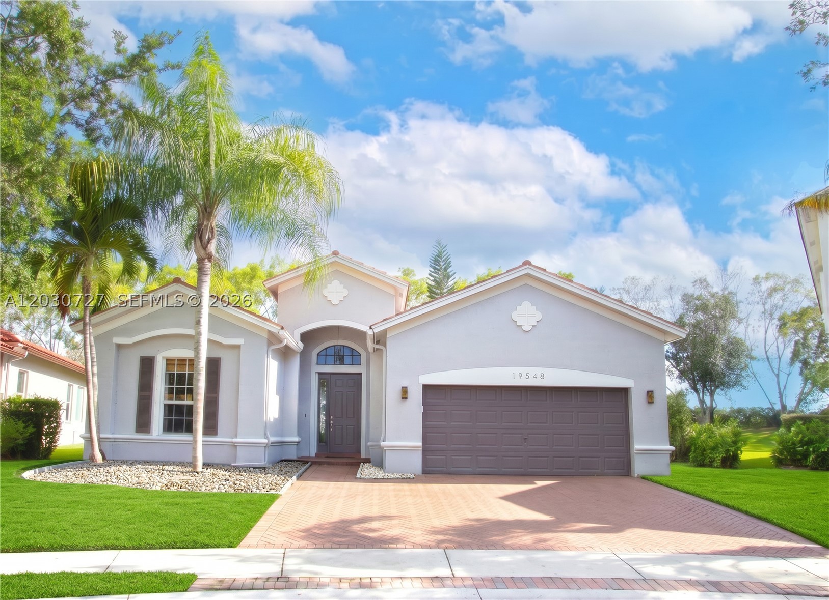 Rare opportunity in Isles at Weston! This exceptional one-story Whitewater model is situated on a premium oversized lot with no rear neighbors, offering exceptional privacy, peaceful views, and one of the community’s most desirable locations. The spacious backyard provides room to build your dream pool and outdoor retreat Lovingly maintained by the original owner, this home features 4 bedrooms, 3 full bathrooms, and approximately 2,871 sq ft of living space, plus redesigned flexible areas creating up to 6 functional private spaces. The family room was converted into a private social media room, and the formal dining room into a home office Upgrades include double insulation for energy efficiency, smooth finished walls, two garage access doors, attic access ladder, upgraded baseboards, modern lighting, Italian ceramic flooring, and 4" waterproof wood-look flooring throughout the bedrooms and bathrooms. Bathrooms feature floor-to-ceiling ceramic tile. The remodeled kitchen offers white quartz countertops, upgraded cabinetry, modern appliances, and a 5-door refrigerator. Additional improvements include fresh exterior paint, enhanced landscaping, and quality finishes. Enjoy resort-style amenities including a clubhouse, pool, fitness center, recreation areas, and playgrounds. Conveniently located about 1 mile from top-rated Broward schools, 2 miles from Cleveland Clinic Weston and Weston Town Center, with easy access to major highways and approximately 20 minutes from the airport.