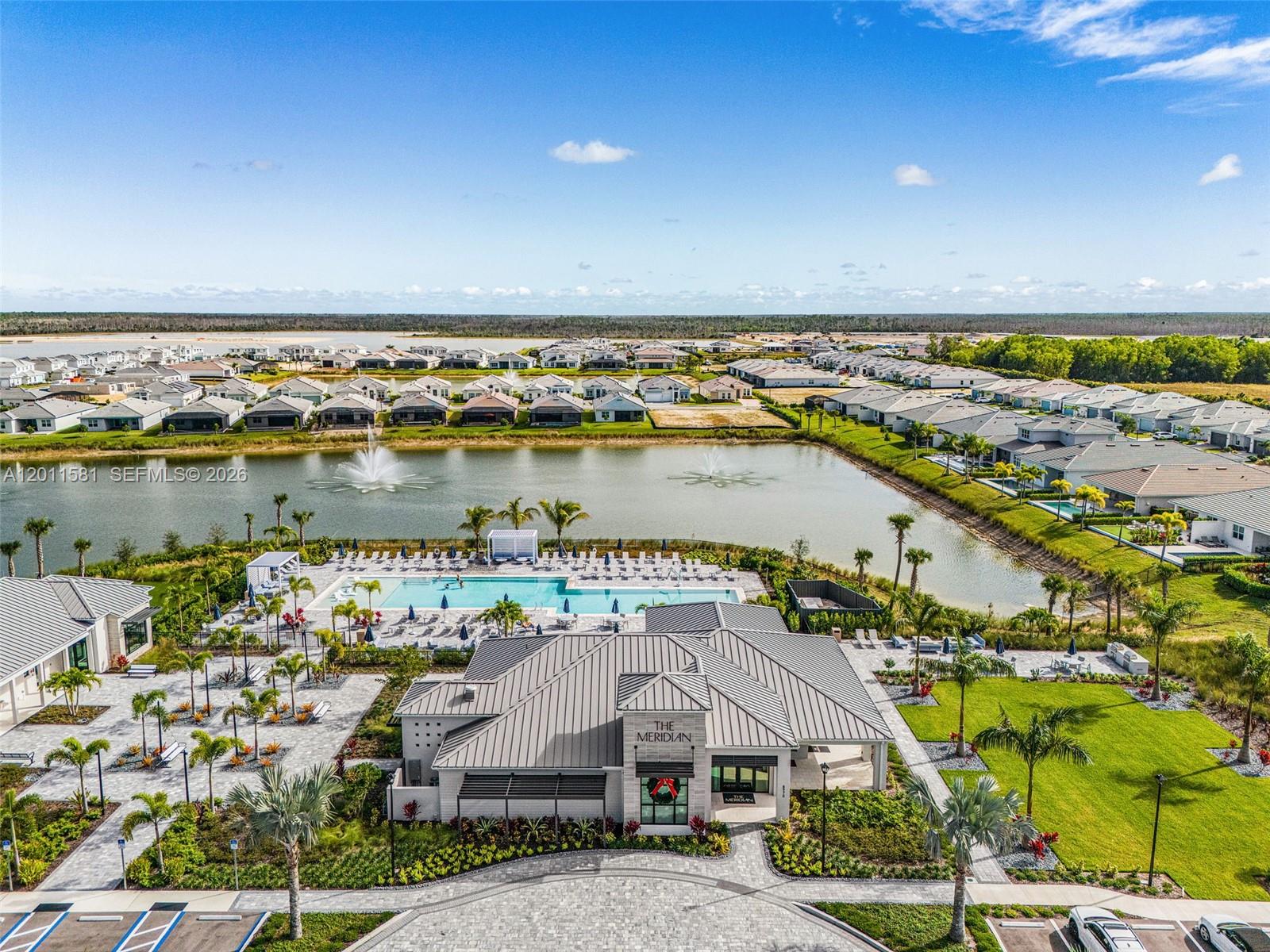 Welcome to this gorgeous Pinellas model waterfront home at Seven Shores in desirable Naples, FL. This brand new, never-lived-in, open-concept home offers 4 bedrooms, 3 baths, soaring 12-foot ceilings, and an amazing chef’s kitchen, all built to the highest standards with impact-resistant windows and doors. Featuring over $245,000 in upgrades, this showroom-quality home includes luxury finishes throughout, alternate island configuration and upgraded cabinetry in the kitchen, gold-sparkled quartz countertops and designer tile backsplashes, premium flooring throughout, enhanced lighting with multiple additional recessed fixtures, top-of-the-line Jenn Air appliances, high quality motorized window treatments, multi-slide doors in the living room leading to a spacious patio,  an extended covered lanai with a full-height privacy wall, an outdoor kitchen prep package, epoxy-coated garage flooring, gutters throughout the house, and stunning west-facing water views with breathtaking sunsets. Located in a rare natural gas and no-flood-insurance community, Seven Shores offers resort-style amenities including an amazing clubhouse, resort style pool, fitness center, pickleball and tennis courts. This home is move-in ready and designed for the ultimate Naples lifestyle.