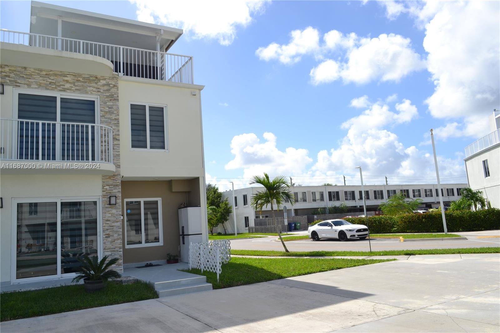 Welcome to this stunning four-bedroom, three-and-a-half bath townhome in Homestead. This corner unit has been fully remodeled with the original construction.
Impact windows provide both security and energy efficiency, and the concrete roof has been cleverly utilized as a double terrace, perfect for enjoying cool afternoons with a cup of coffee or a glass of wine. With three parking spaces, you'll never have to worry about finding a spot for your vehicles. On the main floor, you'll find a one-bedroom, one-bathroom suite with an independent entrance, ideal for generating extra income with privacy and comfort.
Don't miss out on the opportunity to make this your forever home. Live the life you've always dreamed of in this beautiful townhome.