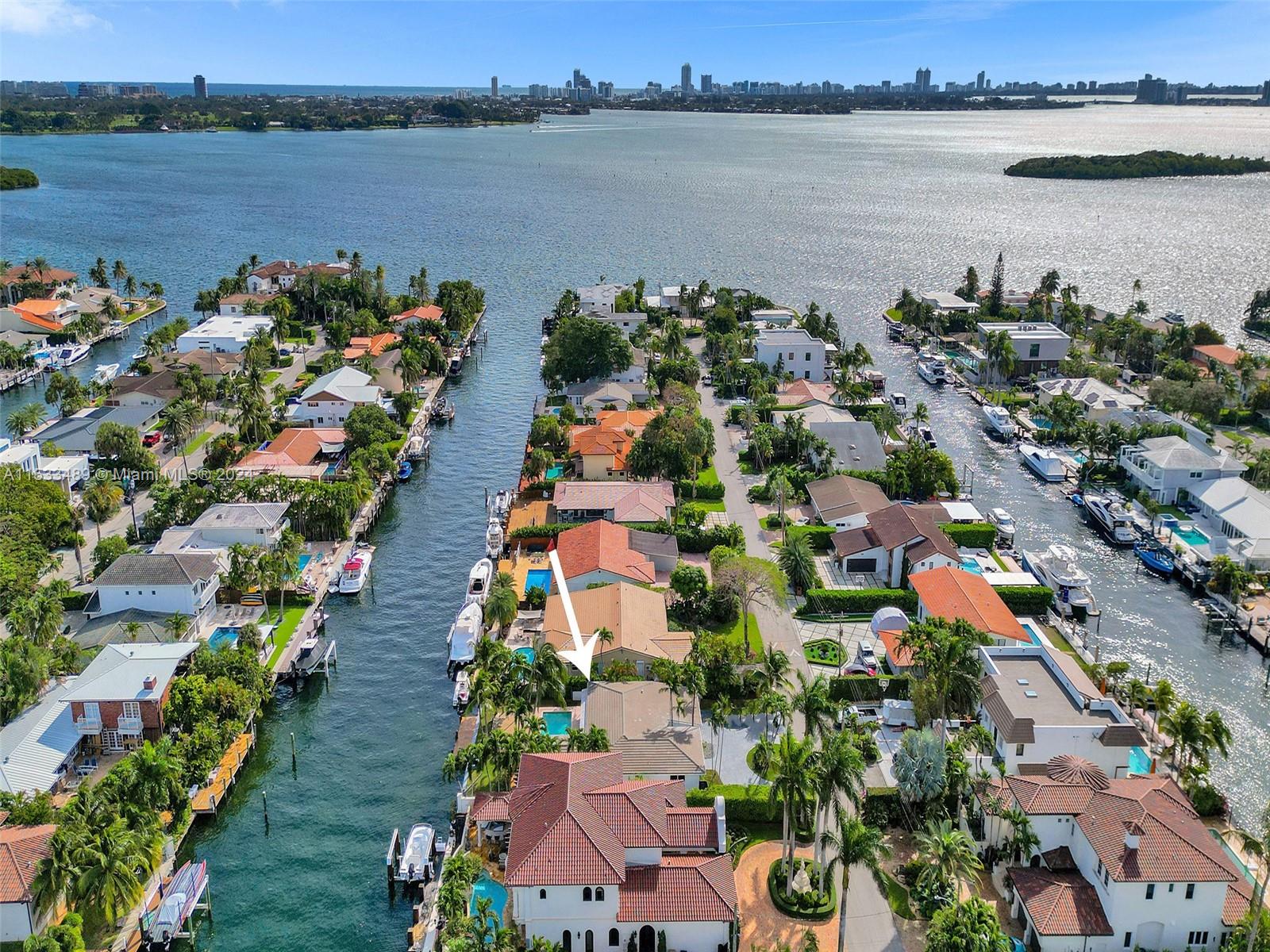 Experience Miami, Waterfront Living. Gorgeously Renovated, & Abundant Natural Light: Open Floor Plan, Custom Millwork w/ Flex Space 2-Car Garage. Per Updated Survey, enjoy 2,287 SF of Interiors that effortlessly blends Indoors & Outdoors. Enjoy ALL NEW: Dock, Custom Closets, A/C Units, Tankless Water Heater, Electrical, Roof, Landscaping, Fence, Exterior Lighting and more. BOATER'S PARADISE w/ 75 ft Waterfront, No Fixed Bridges, Direct Ocean Access, & Shore Power. Sans Souci is a single-entrance gated community w/ Police stationed at the Guard House. Situated on Biscayne Bay across from Indian Creek & Bal Harbour, minutes to The Design District & Aventura. AVAILABLE Furnished or unfurnished.