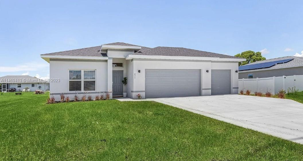 Brand new construction on an OVERSIZED CORNER LOT WITH A FENCE! NO HOA. NO FLOOD INSURANCE REQUIRED. ON CITY WATER AND SEWER! This gorgeous home offers 4 bedrooms, 2 baths and 1691 sq ft. of living space. The kitchen features granite countertops, stainless steel appliances, 42-inch cabinets with soft-close drawers, and a large kitchen bar with plenty of counter space. This home also comes with a 3-car garage which will give you plenty of space to keep your vehicles and more. Other features include tile throughout, vaulted ceilings, a screened-in lanai, tons of storage space, and hurricane-impact doors and windows. This property is on city water, sewer, and irrigation. The home is beautifully landscaped with a sprinkler system already installed. Washer & dryer included.