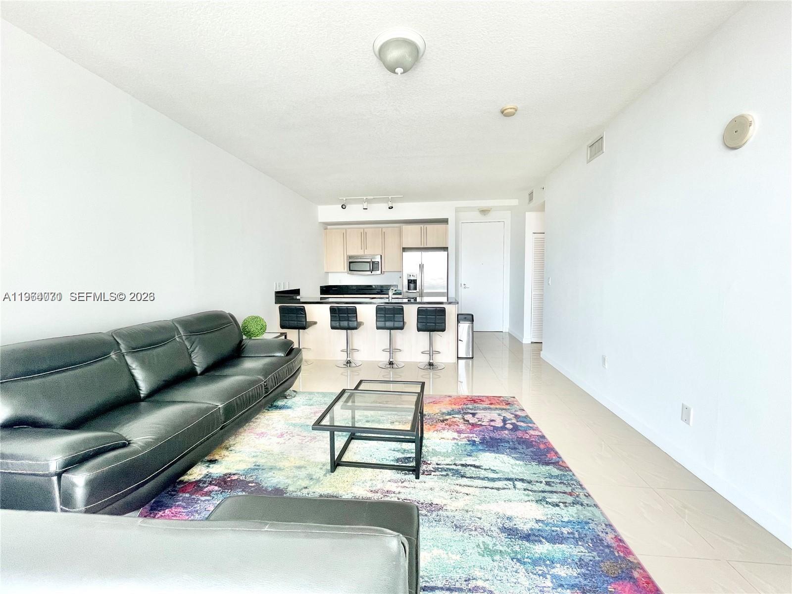Direct bay, city and Brickell skyline views from the best line in the building. 1BD/1BA featuring porcelain floors, floor-to-ceiling windows, contemporary kitchen with stainless steel appliances and granite countertops, spacious bath with separate tub and shower, in-unit washer/dryer, and 1 assigned parking space. Full-service amenities include 2 pools, jacuzzi, BBQ area, media room, business center, state-of-the-art gym, steam room, and 24-hour valet and concierge. Prime Brickell location within walking distance to Mary Brickell Village, Brickell City Centre, Metrorail and Metromover.