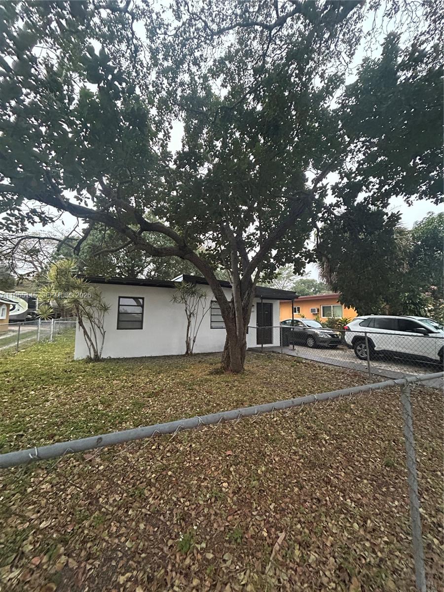 EASY TO SHOW! Nestled on a quiet, tree-lined street, this concrete block home sits on a huge lot with endless potential to expand, renovate, or design your own backyard oasis. Imagine relaxing evenings under the covered, screened-in patio, enjoying the breeze while overlooking your private yard. The large driveway easily accommodates multiple vehicles, perfect for families or guests. Previously rented at $2,300 per month and now currently vacant, this property offers immediate flexibility—ideal as a starter home or investment. Move right in and enjoy the open space and well-maintained fixtures, or gradually expand or renovate to match your vision. Ideally located near Downtown Miami, Fort Lauderdale, major highways, dining, and shopping, you’ll enjoy both convenience and the peaceful feel of a residential neighborhood. Whether you’re looking to invest, occupy, or create your dream home over time, this property delivers space, flexibility, and long-term value all in one.