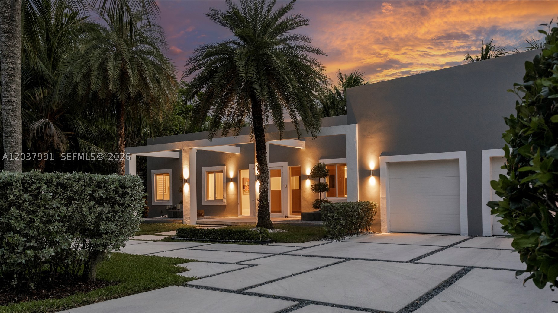 Gorgeous modern ONE-STORY residence nestled in LUSH TROPICAL LANDSCAPING in the charming Village of Biscayne Park. This beautiful home features an open floor plan with high 12 feet ceilings and abundant natural light throughout.  Situated on an EXPANSIVE 18,600 SF CANAL-FRONT LOT, this tropical retreat offers a peaceful and private backyard setting. Adding to its charm is a BEAUTIFUL KOI FISH POND with a walking bridge leading to a waterfront deck, creating a truly serene outdoor oasis.  COMPLETELY REBUILT AND UPGRADED, this home showcases modern porcelain flooring throughout, extensive custom cabinetry, designer window treatments, 2-car indoor garage with an AutoStacker parking lift (creating a 3rd space), smart home automation, security system, and much more.  The spacious CHEF’S KITCHEN IS A TRUE CENTERPIECE, featuring Italian cabinetry, top-of-the-line appliances, an oversized island, and plenty of storage.  Perfectly located just minutes from the prestigious Miami Country Day School, the Design District, beaches, and some of Miami’s best shopping and dining.
Meticulously maintained and truly move-in ready! *** A rare opportunity to enjoy the very best of the South Florida lifestyle! ***