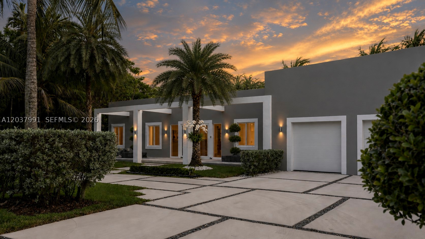 Gorgeous modern ONE-STORY residence nestled in LUSH TROPICAL LANDSCAPING in the charming Village of Biscayne Park. This beautiful home features an open floor plan with high 12-foot ceilings and abundant natural light throughout.  Situated on an EXPANSIVE 18,600 SF CANAL-FRONT LOT, this tropical retreat offers a peaceful and private backyard setting. Adding to its charm is a BEAUTIFUL KOI FISH POND with a walking bridge leading to a waterfront deck, creating a truly serene outdoor oasis.  COMPLETELY REBUILT AND UPGRADED, this home showcases modern porcelain flooring throughout, extensive custom cabinetry, designer window treatments, 2-car indoor garage with an AutoStacker parking lift (creating a 3rd space), smart home automation, security system, and much more.  The spacious CHEF’S KITCHEN IS A TRUE CENTERPIECE, featuring Italian cabinetry, top-of-the-line appliances, an oversized island, and plenty of storage.  Perfectly located just minutes from the prestigious Miami Country Day School, the Design District, beaches, and some of Miami’s best shopping and dining.
Meticulously maintained and truly move-in ready! *** A rare opportunity to enjoy the very best of the South Florida lifestyle! ***