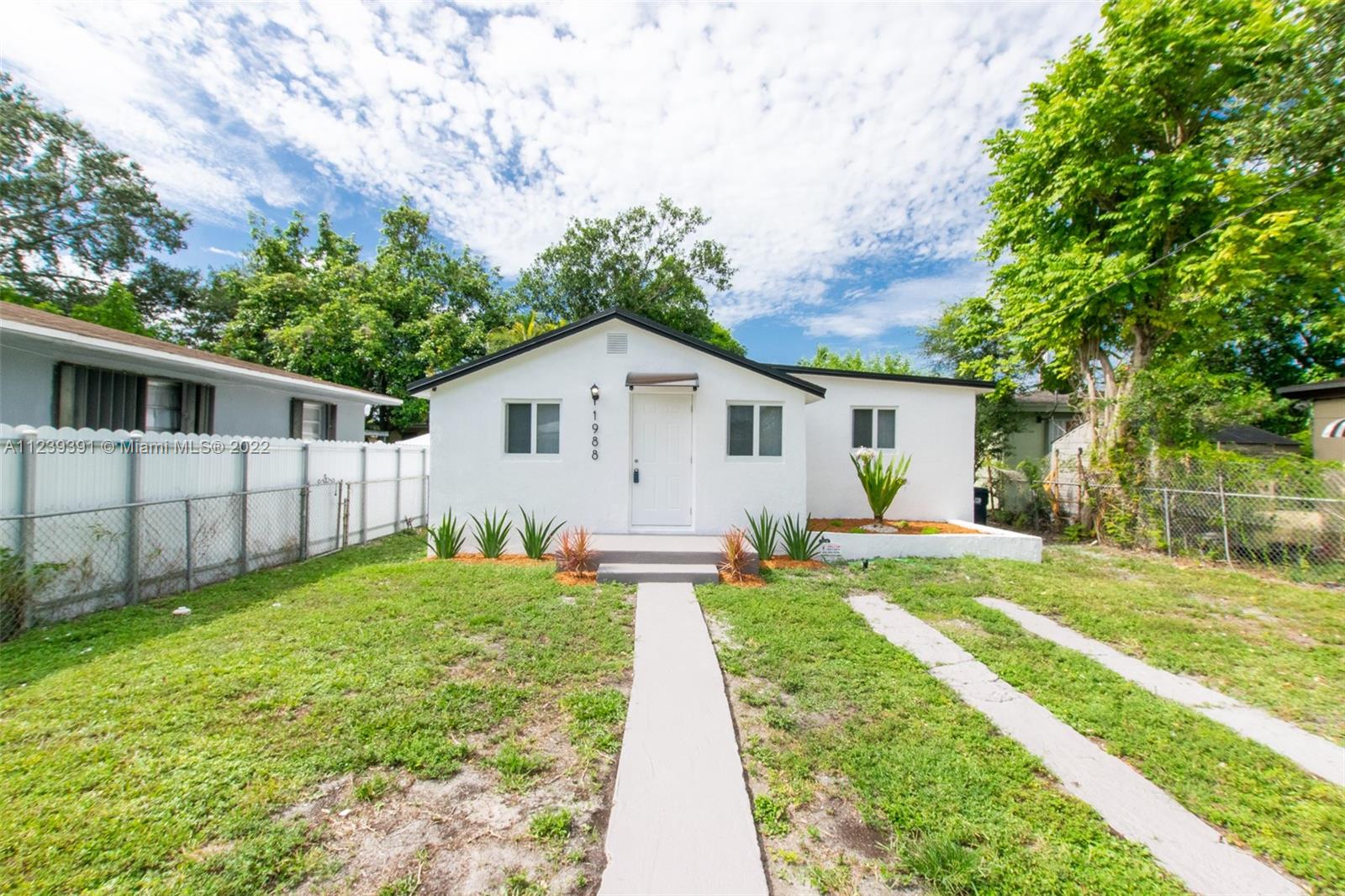 Beautifully renovated 4 bedroom 2 bath, with den/office that is a functional 5th bedroom.  Updates include: modern updated custom kitchen with quartz countertops/backsplash, new stainless steel appliances, new three dimensional shingle roof, updated modern baths, updated electrical, new laminated flooring and new modern baseboards, new interior doors, new closet doors, new interior/exterior light fixtures, repainted interior/exterior, high impact windows, central a/c, hurricane approved exterior doors, new landscaping.  Large front yard with plenty room for parking.  Won't last!!