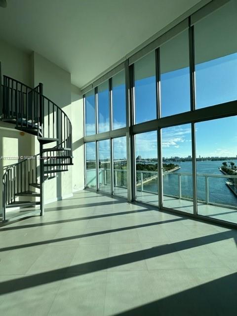 Beautiful one bedroom  one and half bathroom loft style at Marina Blue Condominium. 18 foot windows with direct view of the bay, the Arena and the downtown. Large balcony, one assigned parking space and a storage room. Building amenities include 2 swimming pools (sunset & sunrise), jacuzzi, volleyball court on sand, BBQ grills, fitness center, business center, party room and more. Walking distance to the Arena, Performing Arts Center, shopping mall, restaurants, park. Easy to show text co-agent