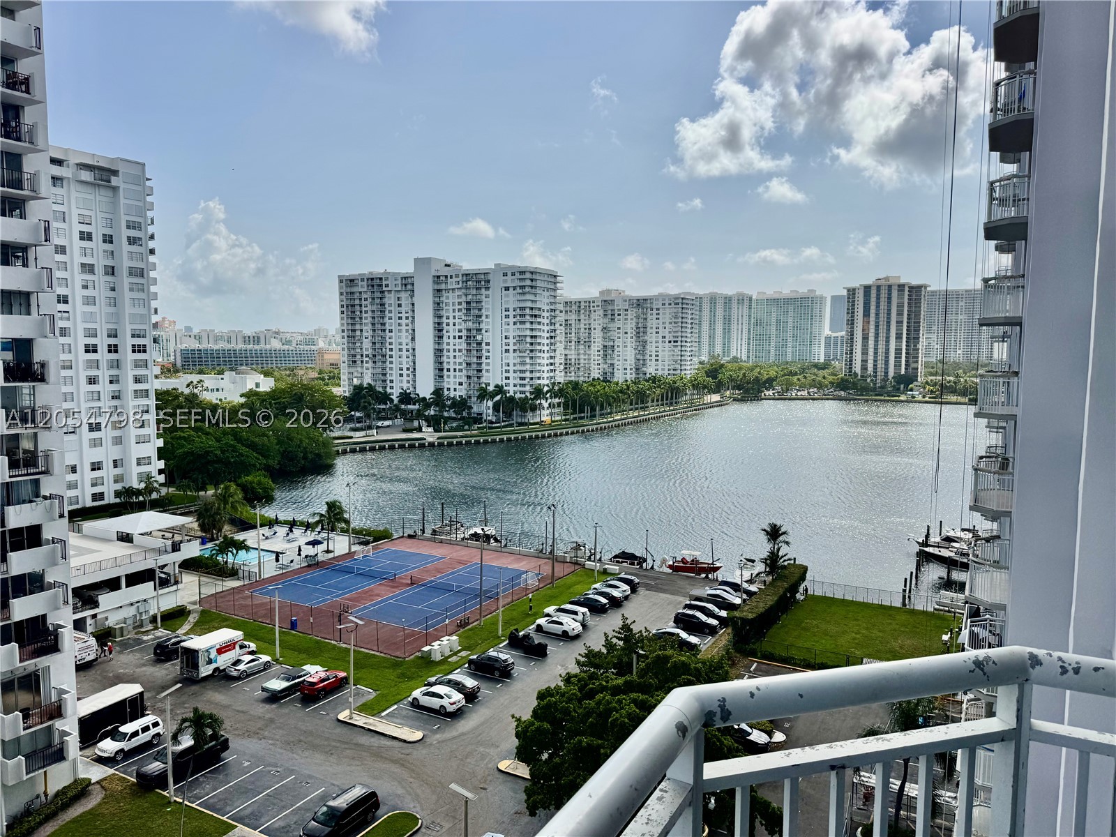 Excellent value in this spacious, light-filled condo featuring a desirable split-bedroom floor plan, with each bedroom offering its own private bathroom. Enjoy two oversized walk-in closets and breathtaking bay views from the private balcony. The unit has been well maintained and is move-in ready.

The community has recently undergone extensive updates, including renovated pools, lobby, and parking areas. Residents enjoy outstanding amenities such as tennis courts, a fitness center, convenience store, and a private marina with Intracoastal and ocean access. Conveniently located within walking distance to shopping, dining, and everyday conveniences, with highly rated schools nearby.
Motivated seller. Easy to show!