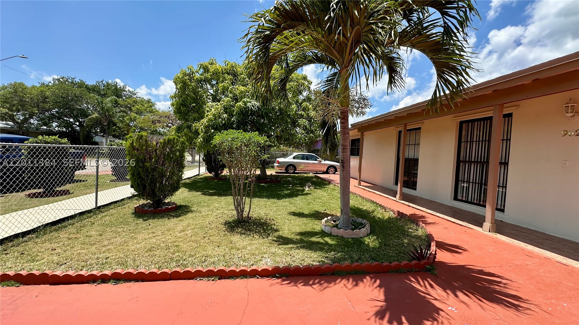 Welcome to this updated 3-bedroom, 2-bathroom home in Palmetto Estates, where comfort, space, and versatility come together. Bright interiors, spacious bedrooms, sleek wood and tile flooring, and abundant natural light create a warm and inviting atmosphere throughout. Step outside to enjoy the expansive screened porch overlooking a large backyard—perfect for relaxing, entertaining, or future possibilities. A fully gated lot offers privacy, and an extra room with its own private entrance presents an excellent opportunity for guest quarters, a home office, or potential extra income. Conveniently situated next to shopping centers, restaurants and service centers, move-in ready, this property is a must-see.