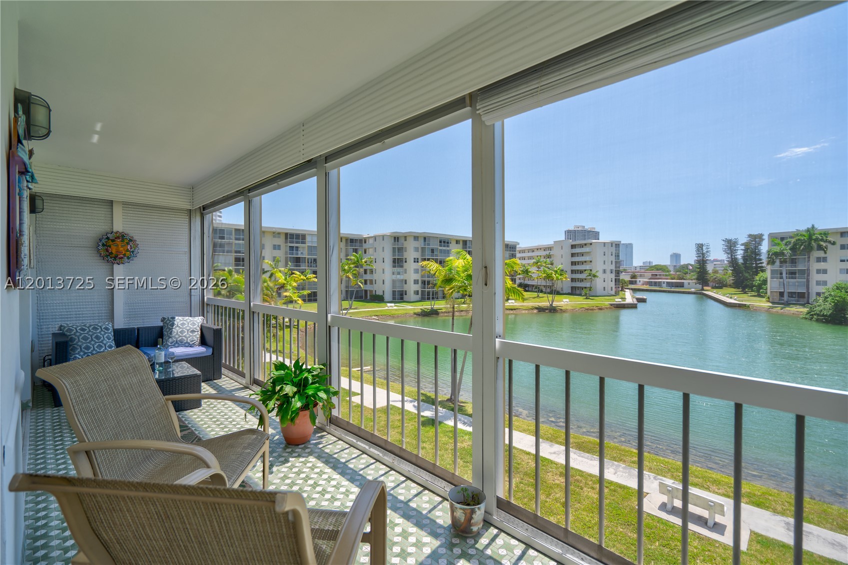 ENJOY STUNNING WATER VIEWS FROM THIS MODERN, UPDATED 2-BEDROOM, 2-BATH RESIDENCE FEATURING A DESIRABLE SPLIT FLOOR PLAN AND A SPACIOUS WRAPAROUND TERRACE. THE CONDO BOASTS A MODERN KITCHEN WITH NEW STAINLESS STEEL APPLIANCES, NEWER CENTRAL A/C, AND A NEW ELECTRICAL PANEL, ALONG WITH HURRICANE IMPACT WINDOWS FOR PEACE OF MIND.  WAKE UP TO SERENE WATERFRONT SCENERY WHERE YOU CAN SPOT TROPICAL FISH, MANY BIRDS & EVEN MANATEES RIGHT OUTSIDE YOUR DOOR.  THE EXPANSIVE BALCONY IS PERFECT FOR ENJOYING BREATHTAKING SUNRISES AND RELAXING OUTDOOR LIVING. LOCATED IN A VIBRANT 55+ COMMUNITY OFFERING EXCEPTIONAL AMENITIES, INCLUDING HEATED POOLS, A LARGE BILLIARD ROOM, FITNESS CENTER, HOT LUNCHES SERVED, 24-HOUR GATED SECURITY, AND A SCENIC WALKING PATH ALONG THE WATER.  RESIDENTS ENJOY AN ACTIVE LIFESTYLE WITH YOGA, KAYAK CLUB, PING PONG, BOOK CLUB, WATER AEROBICS, MOVIE NIGHT, DANCING NIGHT & MUCH MORE.  CONVENIENTLY SITUATED NEAR TOP RESTAURANTS, SHOPPING AND JUST MINUTES TO AVENTURA MALL, FOOD SHOPPING, THE BEACHES & I-95. WALKING DISTANCE TO PLUM MARKET, ANTHONY'S & MORE. SERVICE PETS ARE ALLOWED! COMPLIMENTARY BUS AND CAR SERVICE MAKES GETTING AROUND EFFORTLESS. NEW ROOF & NEW ELEVATORS. 50 RECERTIFICATION HAS BEEN COMPLETED! THIS CONDO IS CLOSE PROXIMITY TO THE ELEVATORS & LAUNDRY ROOM! LOTS OF GUEST PARKING!
