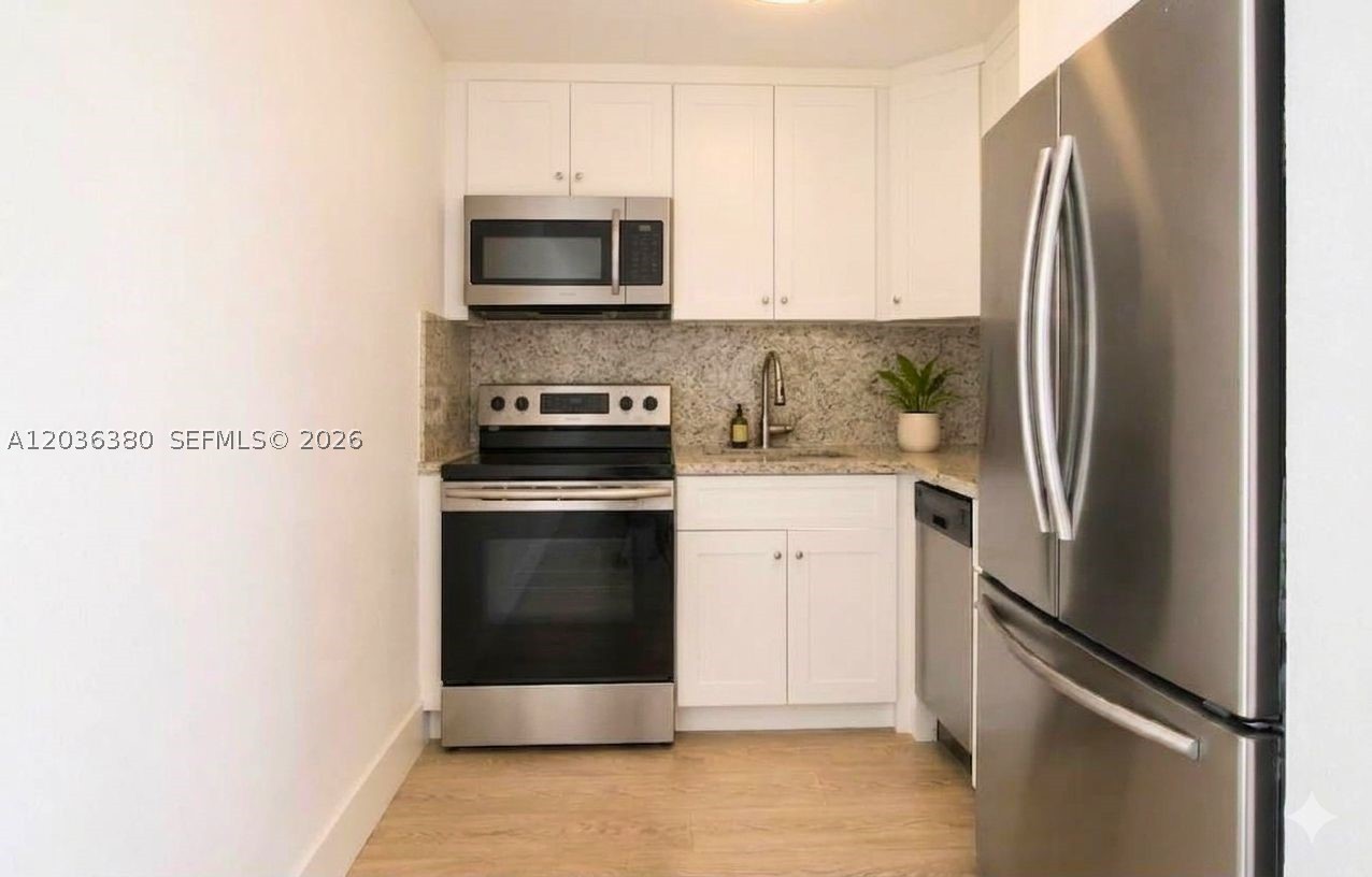 EXCELLENT CENTRAL LOCATION RIGHT NEXT TO BRICKELL! Skip the commute and move right into this beautifully updated 638 Sq.Ft. 1BR/1BA retreat at Villa Navarre Condominium. Perfectly tailored for relocating medical professionals, executives, and project managers, this generous unit sits at the crossroads of Miami’s major hubs. Enjoy a brand-new kitchen with white wood cabinetry, stainless steel appliances, and sleek wood-style flooring throughout. Minutes from Jackson Memorial Hospital, UM, and the Design District, with a highly walkable layout right next to the energy of Brickell. Key Perks: Includes your own assigned parking space (a rare find!), secure gated community living, and 5 on-site laundry units. Seconds from I-95 and the Metrorail. Clean, bright, and available immediately. Easy to show—contact Agent/Owner today! (Architectural Rendering: The floor and wall are unchanged.)