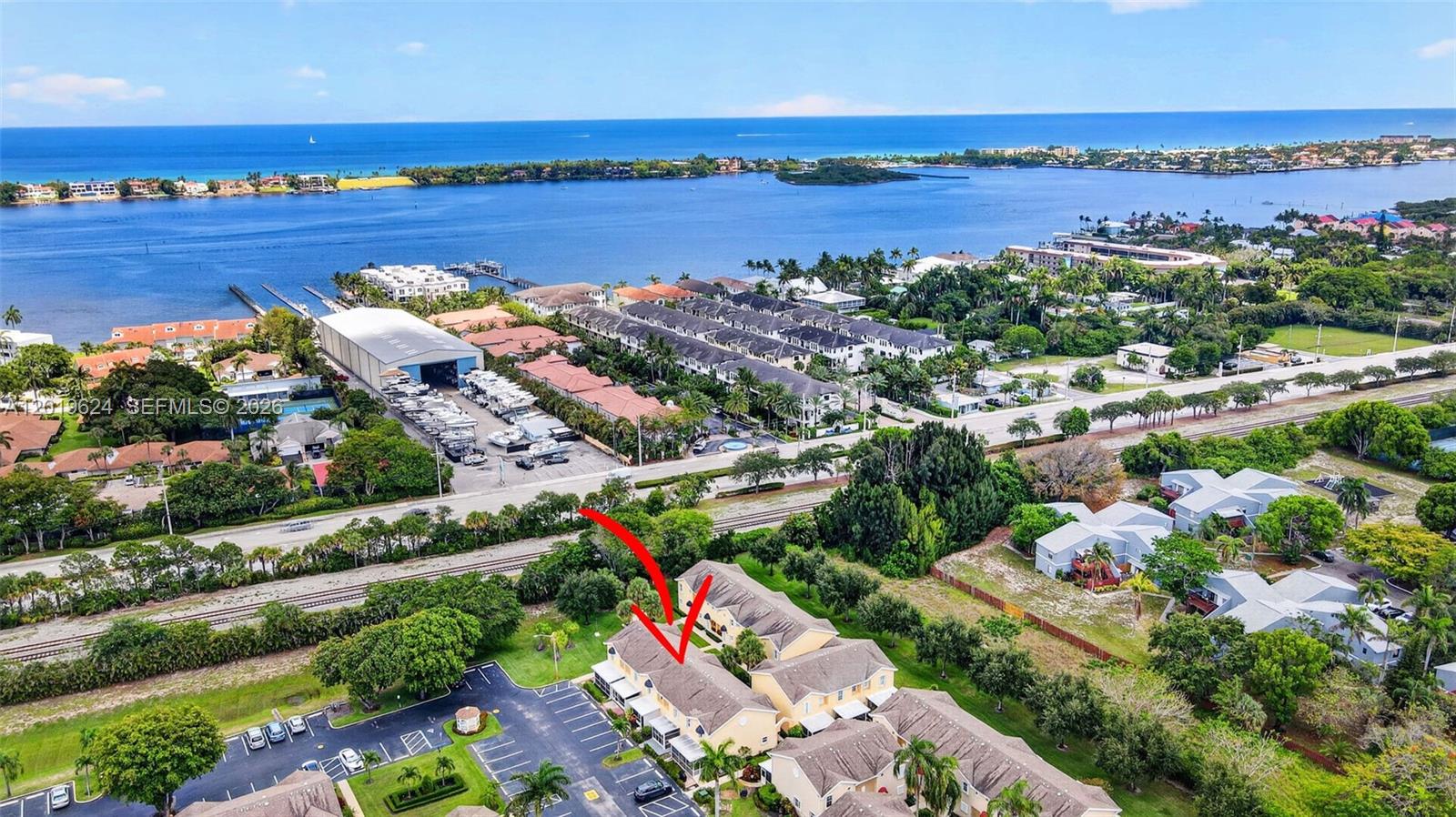 Beautifully remodeled 2-bedroom, 2.5-bathroom townhouse in the gated, all-ages community of Waterside Village. This bright and spacious two-story home features tile flooring throughout, an in-unit washer and dryer, and a functional layout with both bedrooms upstairs and a convenient half bathroom on the main floor. Sold fully furnished and turnkey. The living area opens to a screened Florida room with direct access to the barbecue area and parking, making it easy to access your car from the back patio. Enjoy resort-style amenities including 2 pools, hot tub, tennis courts, pickleball, shuffleboard, and bocce ball. Conveniently located just minutes from the beach, shopping, and dining. Pet-friendly community for pets up to 10 pounds, with flexible rental opportunities. Internet is included in the association fees. Perfect for year-round living or a seasonal retreat.