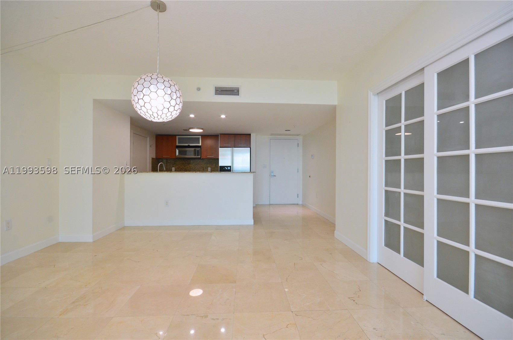 Metropolis Downtown Dadeland 2-bedroom, 2-bath + den with two assigned parking spaces! This beautiful and spacious 1,350 sq. ft. corner unit is walking distance to Publix, Dadeland Mall, Dadeland Station, Metrorail, and top-notch dining, shopping, and entertainment. Major roadways US1, 826, and 878, plus the City of Pinecrest, City of South Miami, and Baptist Hospital are all nearby. Featuring a bright an open layout with polished marble floors, large bedrooms with walk-in closets, spacious bathrooms, new central AC, a modern kitchen with stainless steel appliances and granite countertops, in-unit washer and dryer, high-impact windows with sweeping city views, and a large open balcony perfect to enjoy sunsets and Florida’s gorgeous weather. The 12x10 den with a generous closet is ideal as an extra guest room, home office, or hobby room. Metropolis offers full-service luxury amenities including 24/7 concierge, valet parking, security patrol, a state-of-the-art gym, cardio fitness center, sauna, two pools, jacuzzi, and a resident lounge. A must see and easy to show on electronic lockbox!