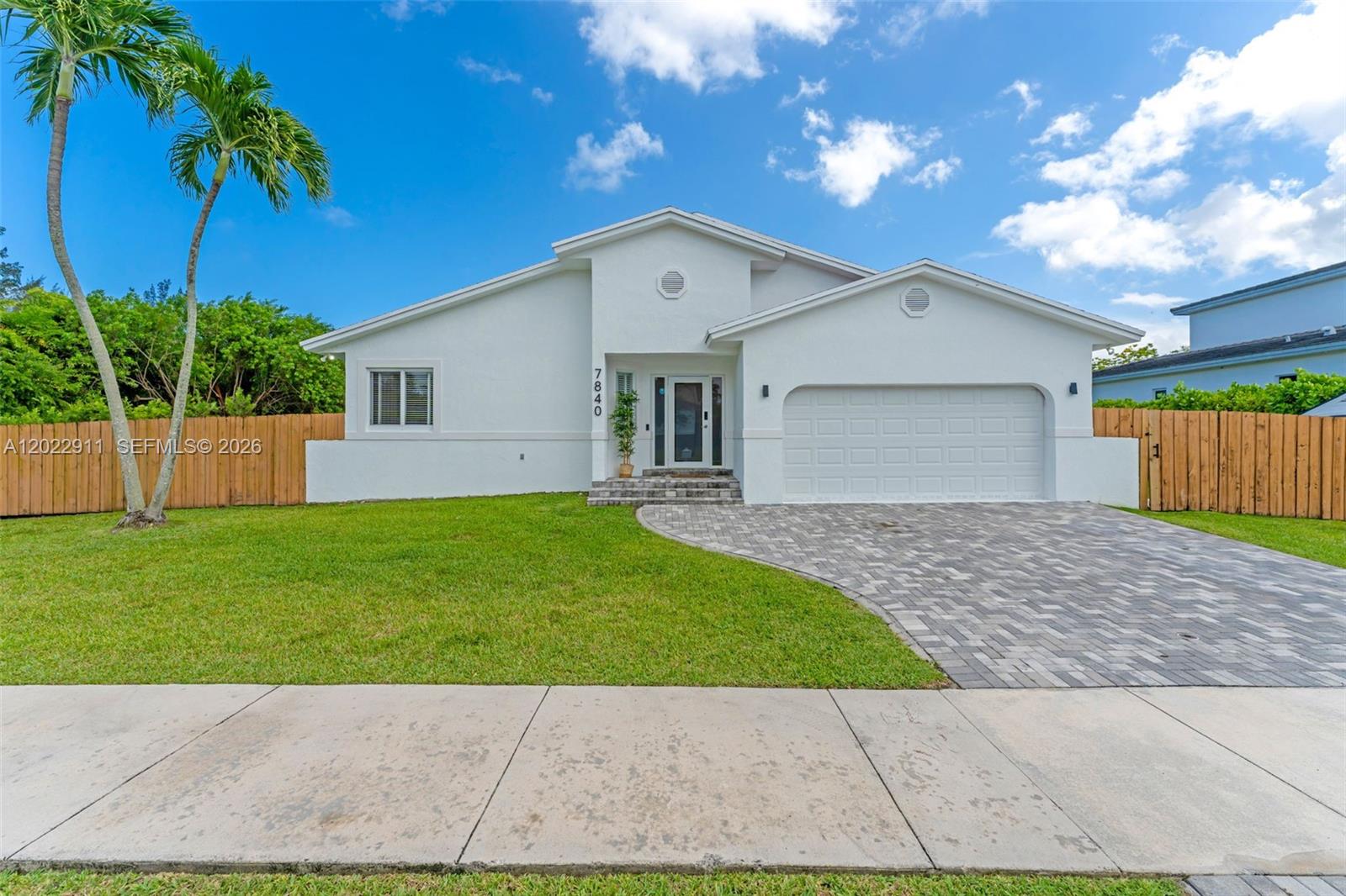 CORNER LOT | SALTWATER POOL | DESIGNER HOME. This is not your average turnkey — this is a carefully curated, designer-touched 3-bedroom, 2-bathroom pool home sitting on a nearly 9,200 SF corner lot in one of Cutler Bay's most desirable communities. The brand new master bathroom is a showstopper, and the renovated kitchen and updated bathrooms carry that same elevated finish level throughout. Brand new flooring, fresh modern touches, and a layout that simply works. Impact windows and doors, a 2016 roof, and a brand new 2025 5-ton A/C unit mean the big ticket items are handled. Step outside to your private oasis — a 2022 saltwater heated pool ready for year-round enjoyment. The corner lot delivers extra space, serious curb appeal, and room for your boat, RV, or all the toys. The converted garage is a fully functional 1-bedroom, 1-bathroom in-law quarter — perfect for extended family, guests, or rental income. Minutes from shopping, dining, and major highways. Move right in and start living exactly how you imagined.