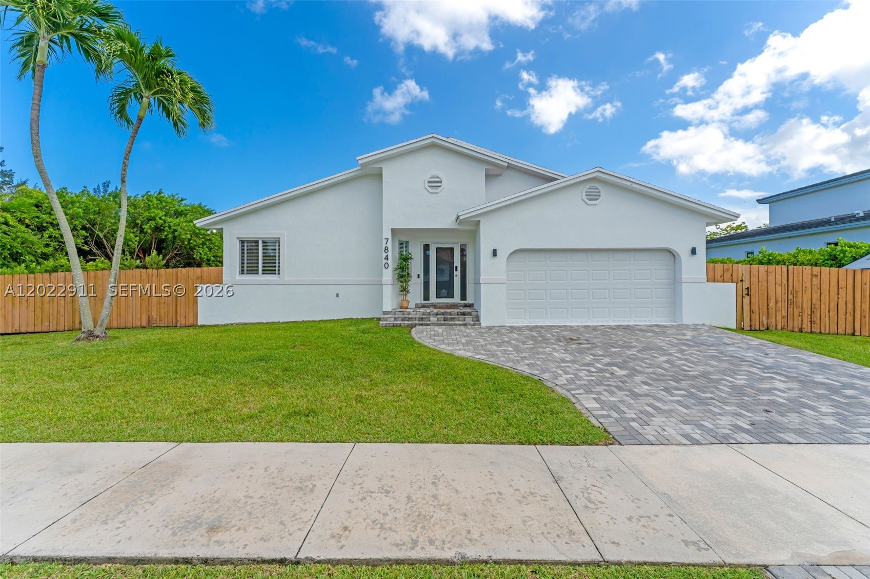 CORNER LOT | SALTWATER POOL | DESIGNER HOME — This is not your average turnkey — this is a carefully curated, designer-touched 3-bedroom, 2-bathroom pool home sitting on a nearly 9,200 SF corner lot in one of Cutler Bay's most desirable communities. The brand new master bathroom is a showstopper, and the renovated kitchen and updated bathrooms carry that same elevated finish level throughout. Brand new flooring, fresh modern touches, and a layout that simply works. Impact windows and doors, a 2016 roof, and a brand new 2024 5-ton A/C unit mean the big ticket items are handled. Step outside to your private oasis — a 2022 saltwater heated pool ready for year-round enjoyment. The corner lot delivers extra space, serious curb appeal, and room for your boat, RV, or all the toys. Minutes from shopping, dining, and major highways. Move right in and start living exactly how you imagined.