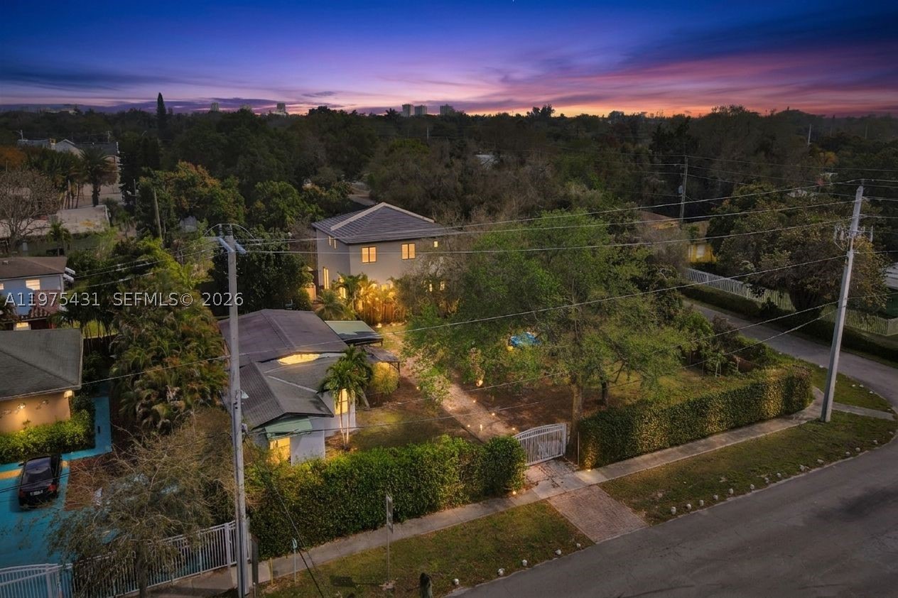 ~ JUST REDUCED ~ MOTIVATED SELLER!!Prime development opportunity in Miami Shores! Oversized 13,815 SF lot with a two-story home featuring a pool, mature landscaping, and fruit trees. The existing home can generate rental income while plans are finalized. Lot offers flexibility for redevelopment, expansion, or custom construction. Centrally located near Barry University, FIU Biscayne Bay Campus, Bal Harbour Shops & Beach, and just 15 minutes to the Miami International Airport. Rare opportunity in a highly desirable area!