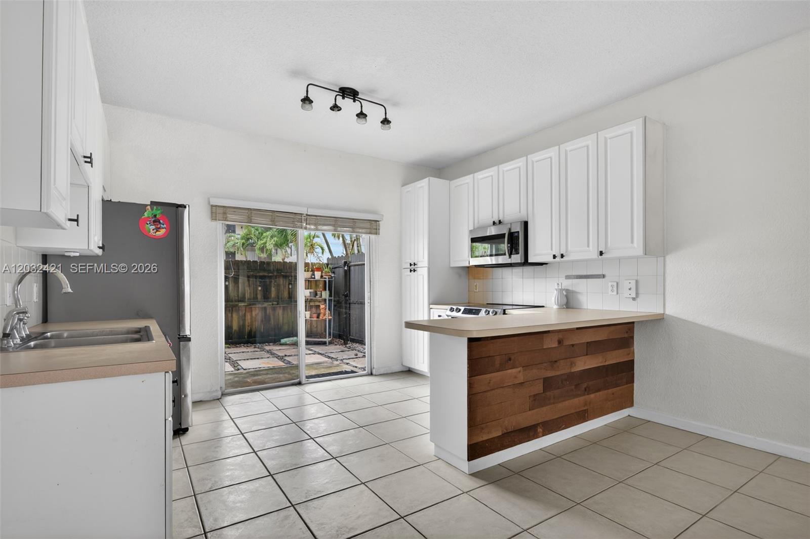 Welcome to this 2-bedroom, 2-bathroom condominium located in Washington Palms Condo in Hollywood, Florida. This well-proportioned residence offers 1,080 square feet of finished living space across the 1st floor, providing an elevated perspective of your surroundings. The thoughtful layout accommodates both living and sleeping areas with distinct spaces for privacy and relaxation. This condominium presents a practical option for those seeking a compact yet functional residence in the heart of Hollywood. This community is on of the rare communities in the area that is gated and offers a community pool.  This corner unit has its own private fenced in yard!! Comes with 2 parking spaces and washer and dryer in the unit!  Ready to Move in NOW!!!!