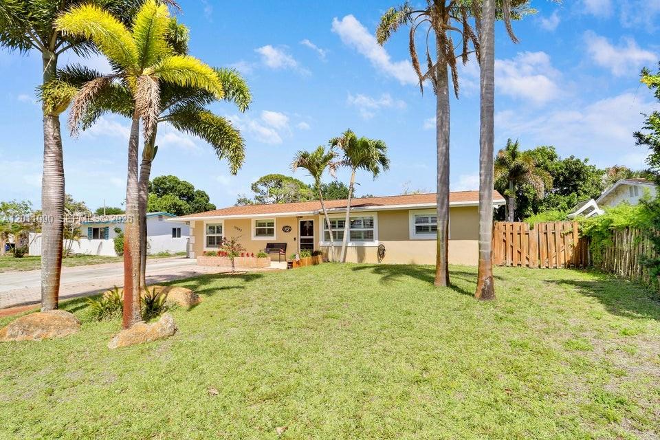 Welcome to 19049 SE Robert Drive. This charming Jupiter home offers 3 bedrooms, 2 bathrooms, and over 2,000 square feet of living space. Designed with both comfort and functionality in mind, the home features two spacious living areas, a formal dining room, and a beautiful open kitchen at the heart of the home. The split-bedroom floor plan provides privacy, highlighted by an oversized owner's suite complete with a beautifully updated bathroom and a custom walk-in closet with built-ins. This versatile layout is perfect for both everyday living and entertaining. Step outside to a beautifully maintained backyard, an ideal space to BBQ, relax, and gather with family and friends. Conveniently located within biking distance to the charming Village of Tequesta, you'll enjoy easy access to local eateries, coffee shops, boutique shopping, and Constitution Park. Just a short drive to the Intracoastal and some of South Florida's most beautiful beaches, Coral Cove Park, Blowing Rocks to name a few. Located in Martin County for lower taxes, and only about 20 miles from PBI Airport. Additional highlights include a 2011 roof, 2023 hot water heater, a recently updated master bathroom featuring a soaking tub and frameless glass shower, newer mini split air conditioning systems throughout, impact windows throughout the front and bedrooms, and panel shutters for the rear. Secure your slice of paradise, schedule your private showing today!