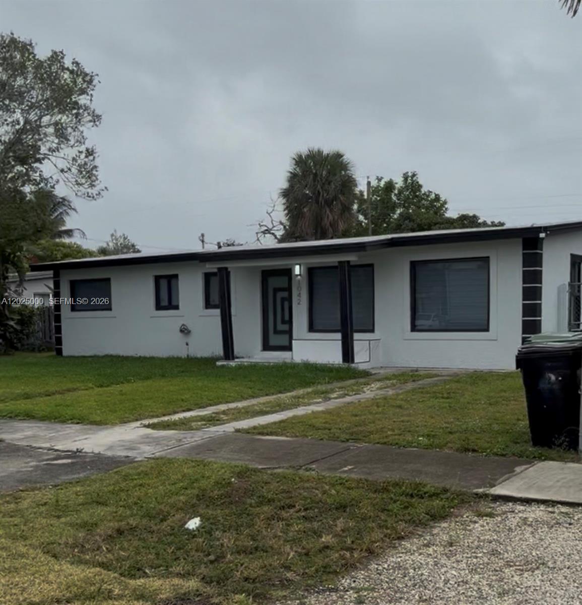Stunning modern-style home featuring 4 bedrooms and 3 bathrooms, including two spacious master suites. Featuring a roof in excellent condition, PVC plumbing, and impact windows and doors throughout. Move-in ready with the big-ticket items already updated.