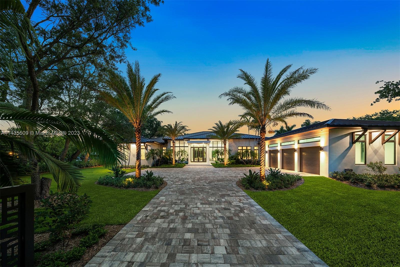 Experience the epitome of luxury in this impeccable 2023 tropical modern estate, meticulously crafted for immediate occupancy. Nestled on over an acre of pristine Pinecrest land, this magnificent residence proudly presents 7 bedrms & 9 bathrms, including a separate guest house w/ its own entrance & garage. Step into an extraordinary flrplan that unveils a chef's dream kitchen w/ state-of-the-art appl, accompanied by a wine cellar & a wet bar. The master suite indulges you w/ a sitting rm & a spa-like bath w/ a soothing soaking tub. Delight in panoramic outdr views, highlighted by a resort-style pool, an inviting infinity spa, a covered terrace, a summer kitchen, & a sprawling yd. Add’l features incl maids' quarters, generator, Creston automation, mudrm/laundry, & 1-yr builder's warranty.