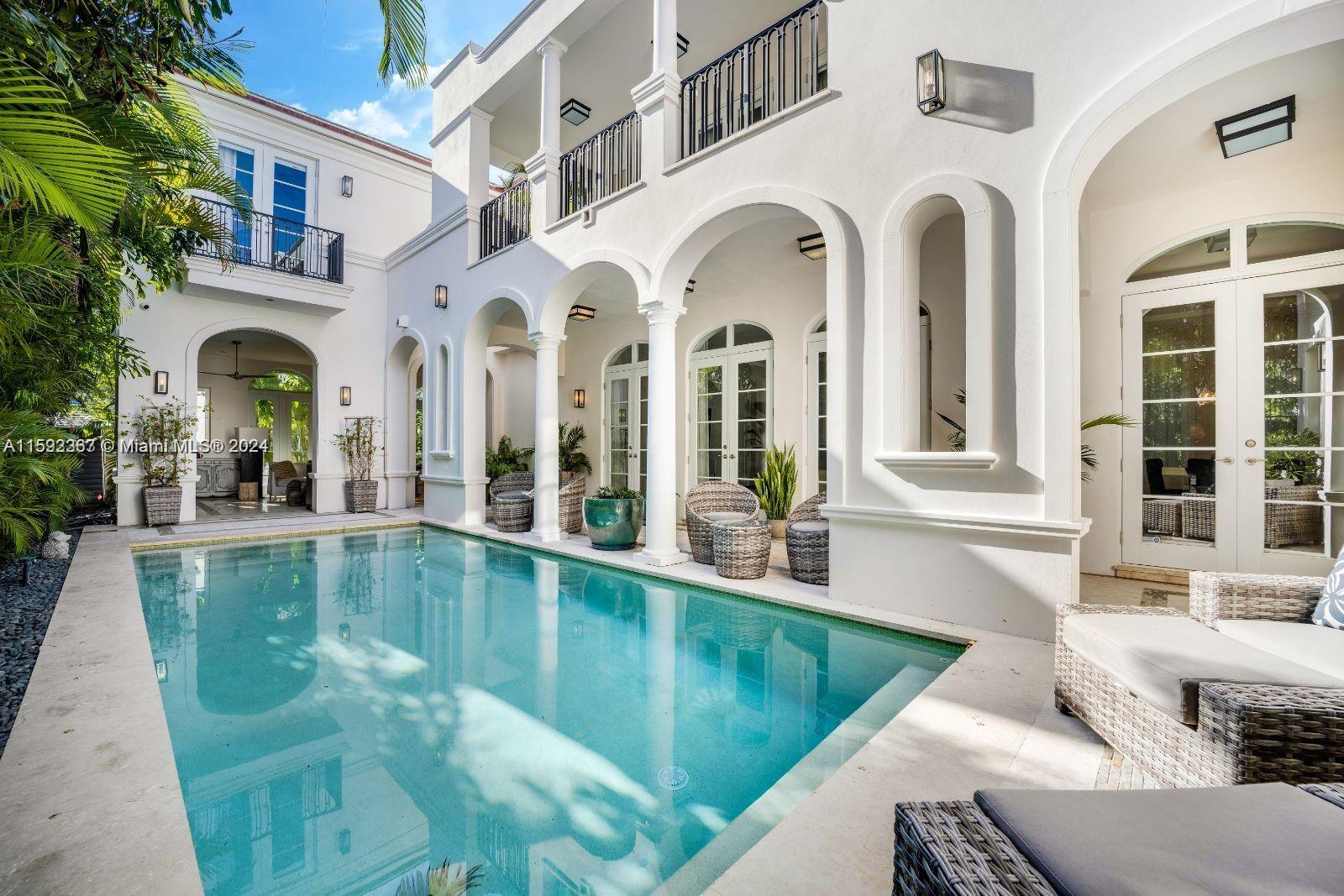 Sellers motivated just reduced for a quick sale Stunning Mediterranean home located in the gated community of
Altos Del Mar on Miami Beach comprised of 22 lots only. just steps from the sand. This pristine villa boasts 4bdrms 4.5 baths including a guest/maid quarter separated from the main home. The French doors throughout open up to courtyards and balconies inviting tons of light to enter, yet very private and quiet to enjoy family or guests. The outdoors include airy poolside living, dining and lounge areas with a summer kitchen. Enjoy the rooftop sun deck suitable for watching the stars or hosting friends while embracing the sounds and views of the ocean. This home is a rare opportunity to experience the epitome of coastal living at its finest.