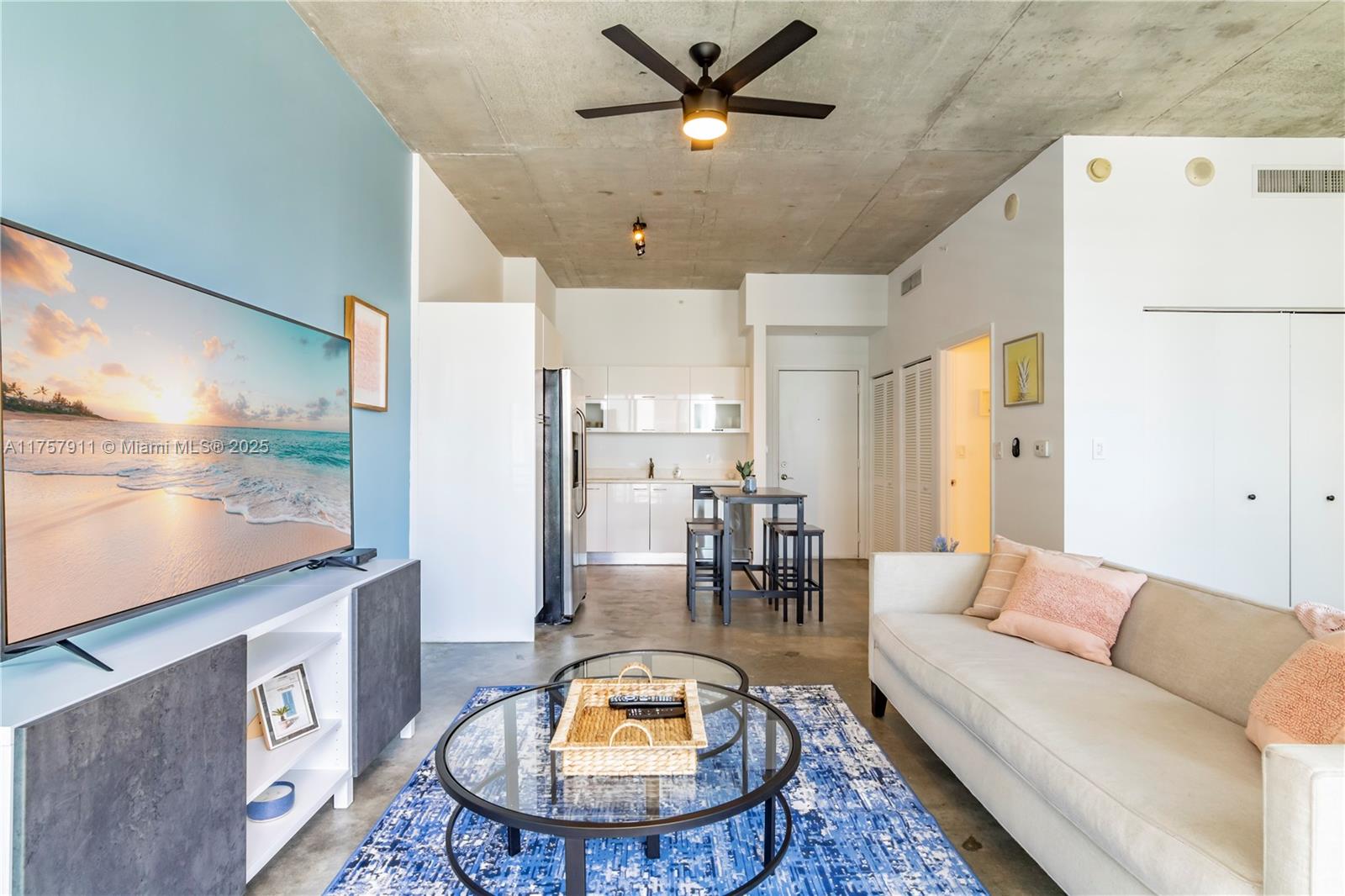 Discover the vibrant lifestyle of downtown Miami in this spacious 1 bed/1 bath unit with soaring 16-foot ceilings with views over the city. This fully furnished condo features modern stainless steel appliances, a large bathroom, in-unit washer and dryer, polished concrete floors, and balcony. The building offers exceptional amenities, including 24-hour front desk service, secure card entry, a recreation room, and a rooftop pool and Jacuzzi with arguably the best views in Miami. There’s also a ground-floor lap pool set in a serene environment. This building offers the opportunity for (30-day) monthly rentals, making it an ideal choice for remote workers seeking flexibility and a vibrant downtown Miami lifestyle. Seller Financing Available for qualified buyers at 6% interest rate & 60% down.