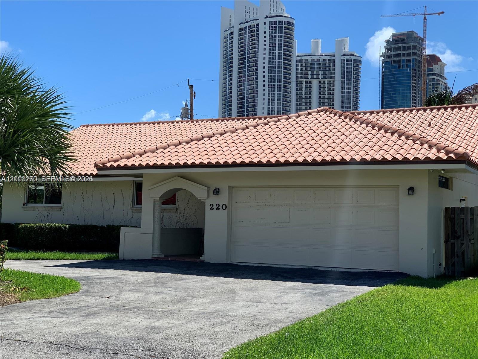 Stunning one-story home ideally located in the heart of Sunny Isles Beach, just a short walk to the ocean. Nestled on a prime lot in a prestigious multi-million dollar neighborhood, this beautifully remodeled residence offers the perfect combination of modern design and coastal living.
Featuring high-volume ceilings and skylights, the home is filled with abundant natural light, creating a bright and airy atmosphere throughout. The modern kitchen is thoughtfully updated with sleek cabinetry and stainless steel appliances, ideal for both everyday living and entertaining.
Spacious living areas flow seamlessly, while built-in closets provide ample storage. A two-car garage adds convenience and functionality. Enjoy the best of South Florida living in this exceptional location, just moments from the beach, fine dining, and world-class shopping.
A rare opportunity to own a stylish, move-in ready home in one of the most desirable areas.