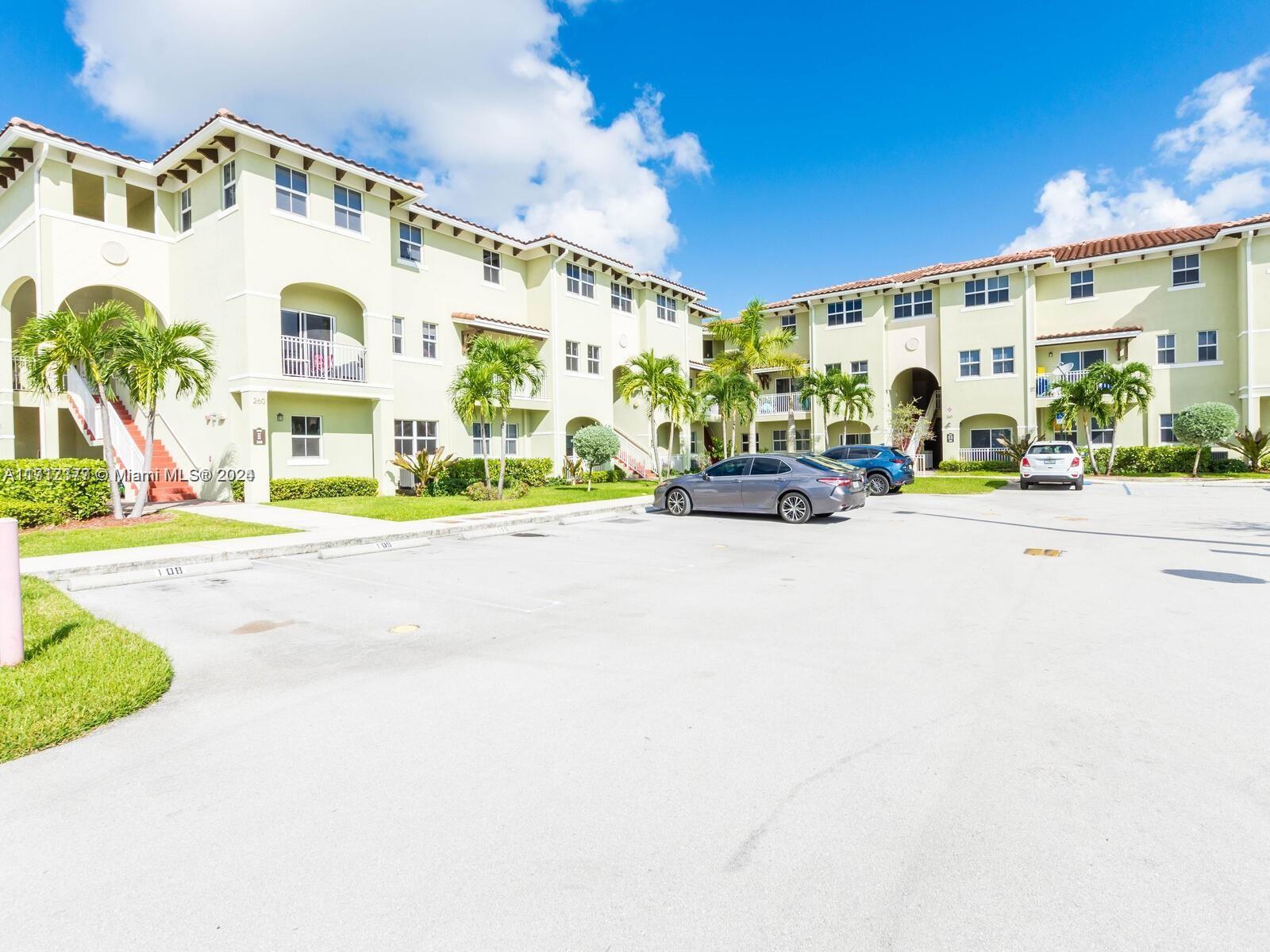 Enjoy this 1st-floor corner apartment with an open and private balcony. 3 bedrooms and 2 1/2 bathrooms with 2 assigned parking spaces, washer and dryer inside, with Italian wood kitchen cabinets and quartz countertops. All tiles throughout, updated bathrooms, new appliances,  freshly painted, and a spacious layout just waiting for you. Centrally located in a gated community with easy access to FIU and major expressways.