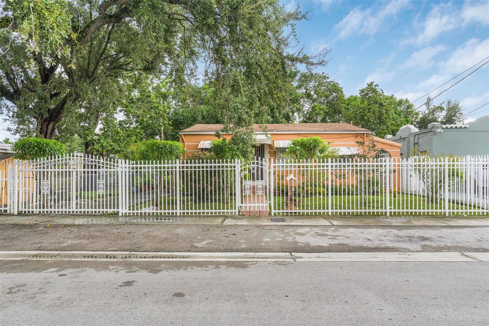 This 3-bedroom, 2-bathroom home welcomes you with a fenced front yard that provides added privacy. Inside, enjoy sleek tiled floors throughout and a modern kitchen with stylish finishes. The home extends to a large, beautiful backyard, offering a peaceful urban retreat. Roof built in 2019. Conveniently located just 15 minutes from Miami International Airport, and close to restaurants, supermarkets, and parks, this property offers the perfect balance of city living with easy access to everything you need.