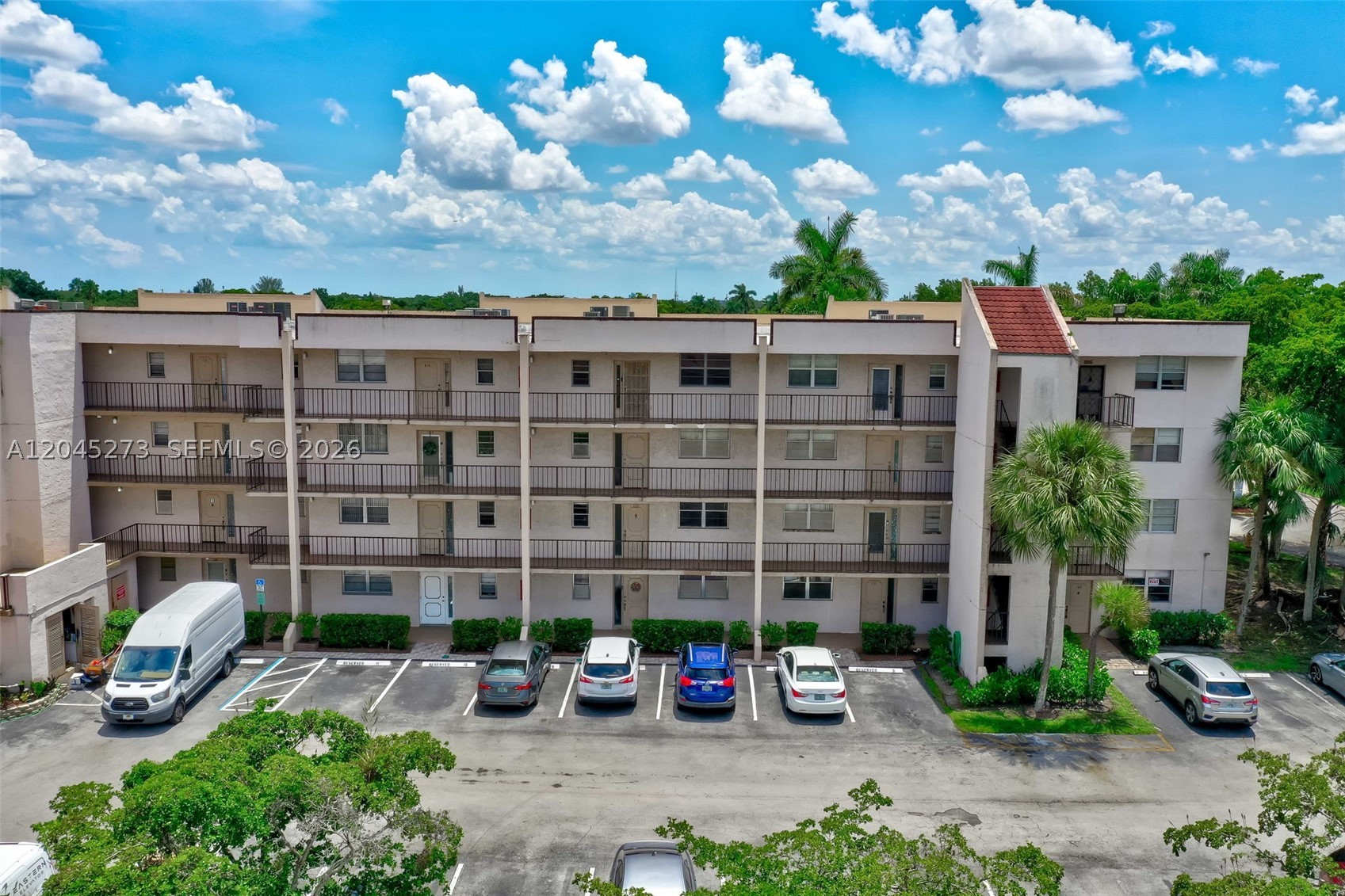 Welcome to this beautifully maintained second floor condo featuring 2 spacious bedrooms with walk-in closets and 2 baths. Recent updates include a newer a/c unit, water heater, garbage disposal,  range (new range is white), flooring, bathroom faucets and door handles. The association has enhanced the community with new elevators, washer / dryers, and a laundry sink for added convenience. This unit offers a lovely view from the screened patio, perfect for or relaxing with your morning coffee or unwinding in the evenings. With its desirable features and prime location, this condo is a must see! PER THE ASSOCIATION, ONE OCCUPANT MUST BE 55+ AND ANYONE OVER 18 PERMITTED. NO LEASING THE FIRST TWO YEARS OF OWNERSHIP!