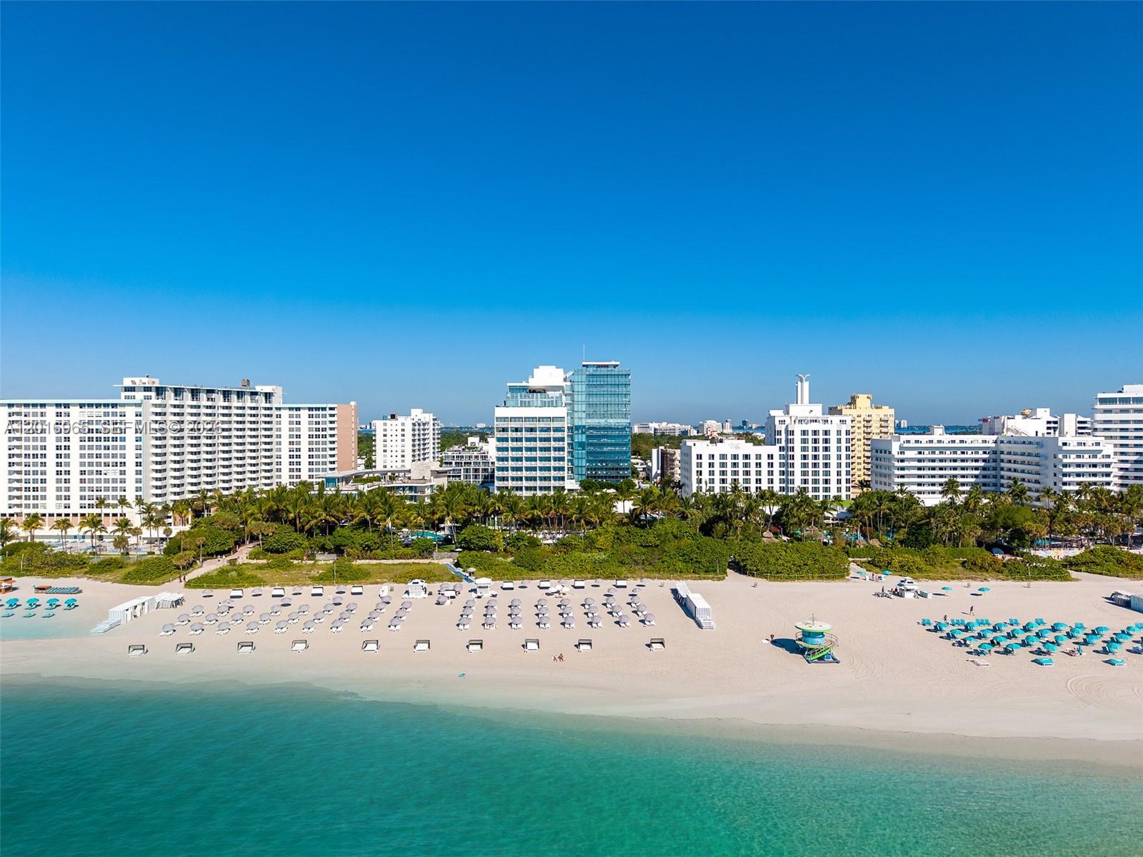 Be one of only 22 privileged owners to reside in unparalleled splendor at The Miami Beach EDITION Residences, the city’s most iconic oceanfront address, envisioned by hospitality visionary Ian Schrager and masterfully designed by renowned architect John Pawson. A rare expression of understated sophistication, this exceptional residence showcases direct ocean views from every room, framed by dramatic floor-to-ceiling glass and complemented by bleached teak wood flooring throughout.
The thoughtfully designed split-bedroom floor plan offers expansive interiors ideal for both private retreat and stylish entertaining. At its heart, the bespoke Bulthaup chef’s kitchen is appointed with premium Miele and Sub-Zero appliances, including a wine refrigerator and built-in cappuccino system.
Residents enjoy access to an extraordinary collection of world-class amenities curated through Schrager’s signature vision of elevated lifestyle living, including a private ice-skating rink, bowling alley, full-service spa, nightclub, beach service, poolside cabanas, 24/7 concierge, and acclaimed dining by Michelin-starred chef Jean-Georges.
With monthly rentals permitted, this is a rare opportunity to own an ultra-luxury oceanfront sanctuary offering the perfect balance of work, relaxation, indulgence, and effortless Miami glamour.