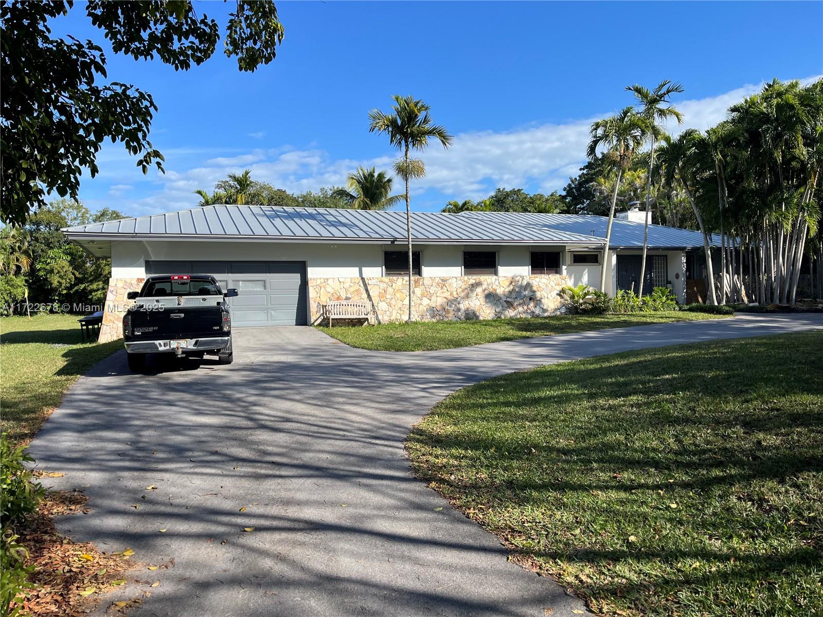 CORAL GABLES**KINGS BAY ESTATES** Built in 1977, 5 bedrooms 3 bath home on builders acre (34,412 SQFT). Private Marina Community with 24-hour access to Deering Bay Marina, with 8 deeded slips, exclusive use for Kings Bay Residents. The home features a new metal roof in 2018, two new split zone A/C Units in 2018, newly renovated free-form solar heated pool with LED lighting, in a very private tropical setting. The massive side or backyard has plenty of secure room for a Tennis Court, multiple boats, and an RV. Interior features include marble floors, Brazilian hardwood floors, and high ceilings with a stunning Tennessee river rock fireplace. Large eat-in kitchen with granite countertops, and stainless steel appliances. Walking distance to Westminster Private School.