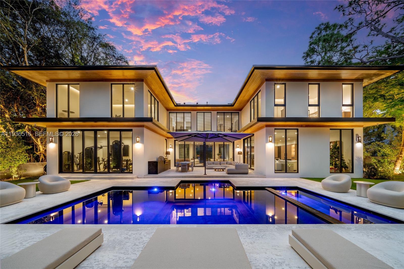 Discover the pinnacle of modern luxury in this 6,847 sqft masterpiece by the acclaimed Calta Group. Nestled on a sprawling 17,000+ sqft lot, this 6-bedroom, 6.5-bath home dazzles with soaring ceilings and sunlit open spaces throughout. The primary suite offers dual walk-in closets, while the gourmet kitchen boasts Sub-Zero and Wolf appliances, sleek Mia Cucina cabinetry, gas powered stove top and oven, and a walk-in pantry perfect for culinary enthusiasts. Seamless indoor-outdoor living awaits with sliding impact doors leading to a private backyard retreat featuring a heated pool, jacuzzi, and outdoor BBQ. Smart home technology, solar panels, a Tesla backup battery, EV charger, elevator, sauna, and steam shower elevate your everyday living. This isn’t just a home—it’s a lifestyle of unparalleled design and sophistication.  Centrally located to the best public and private schools in Miami-Dade as well.