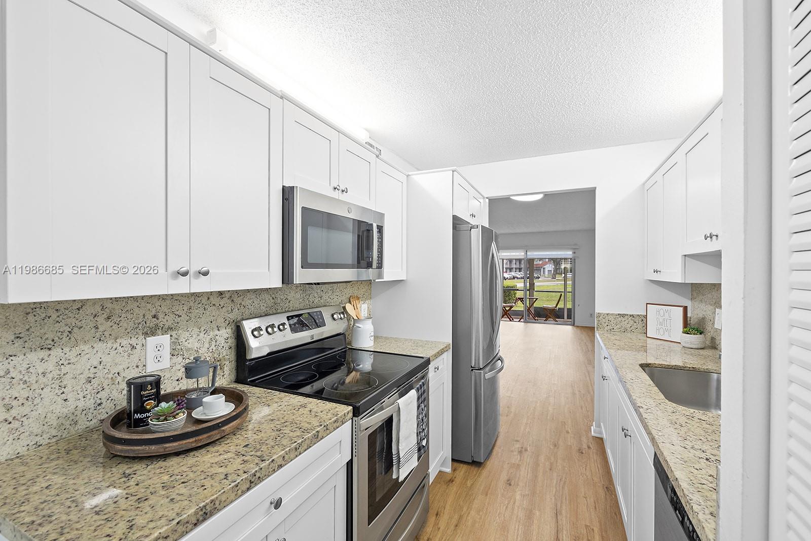 Beautiful 2/2 condo in Century Village, Pembroke Pines. This stunning first-floor unit offers ultimate convenience, just steps from the second entrance and community pool. Features include vinyl flooring throughout and a kitchen with stainless steel appliances. This condo is move-in ready! Enjoy spacious rooms with walk-in closets in both bedrooms and LED lighting throughout for a modern touch. Washer and dryer in unit. Century Village is a 55+ resort-style community offering incredible amenities, including a clubhouse, state-of-the-art fitness center, multiple pools, golf course, tennis courts, pickleball, theater, free shuttle service, 24/7 security, and more. Conveniently located near shopping, dining, and major highways.