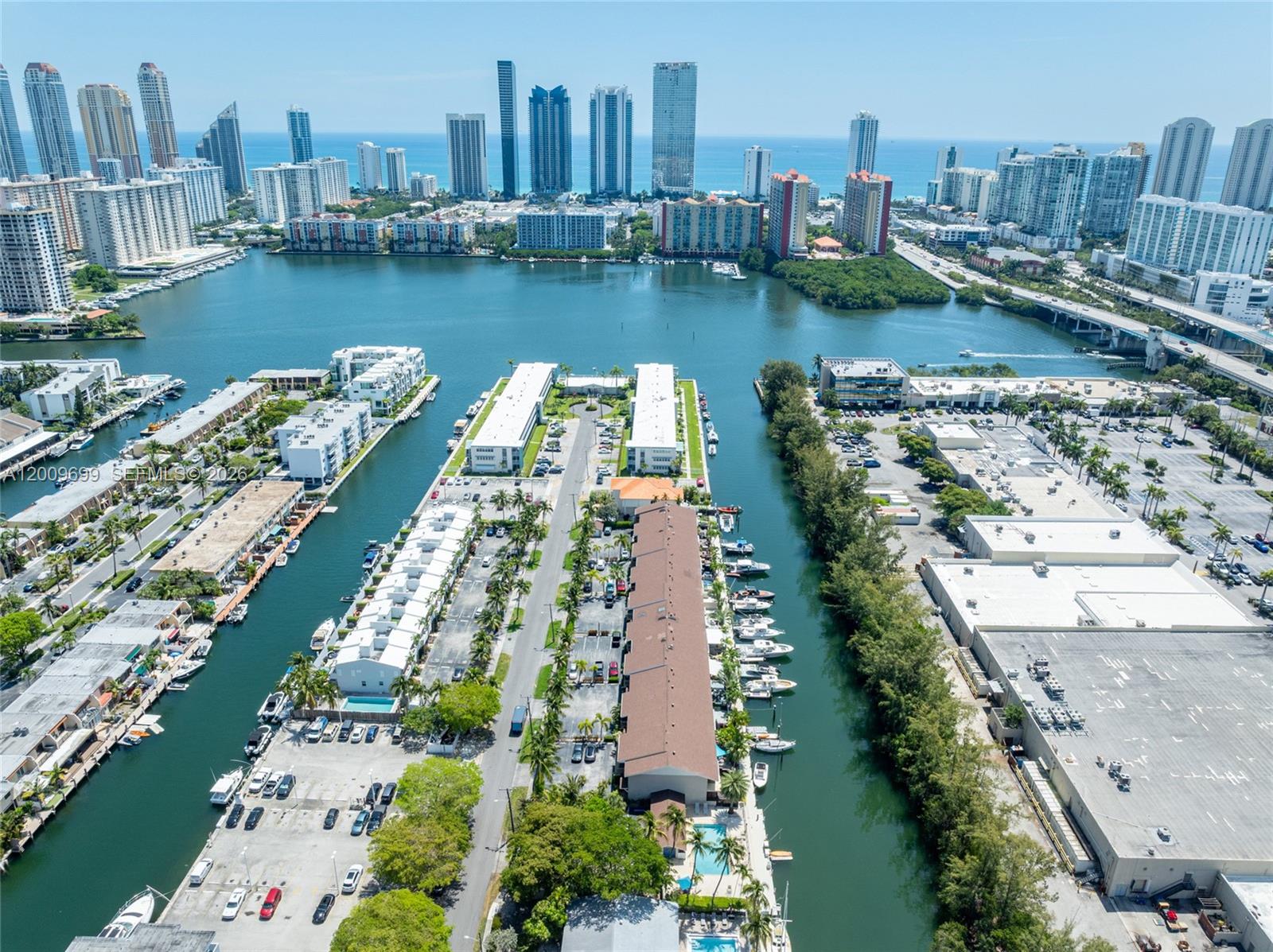 Discover the ultimate boater's paradise in one of South Florida's most exclusive enclaves. Nestled within a gated community, this stunning 3 bedroom, 2.5 bathroom residence offers rare privacy and direct ocean access with no bridges — just seconds from the Intracoastal Waterway and minutes from Haulover Inlet. Your private 37.5' dock sets the stage for an unmatched waterfront lifestyle. Step inside to a completely renovated, open-concept kitchen outfitted with top-of-the-line appliances, flowing seamlessly into bright, welcoming living spaces. Porcelain wood-look tile grounds the first floor while warm hardwood flooring carries through upstairs. Retreat to the expansive primary suite featuring generous walk-in closets and a spa-inspired bathroom with a soaking tub and steam shower. A new front deck, impact glass throughout, and thoughtful finishes at every turn complete the picture. With a low HOA of just $427/month, 2 dedicated parking spots, and ample guest parking, the ease of this lifestyle is unmatched. Live where others vacation.
