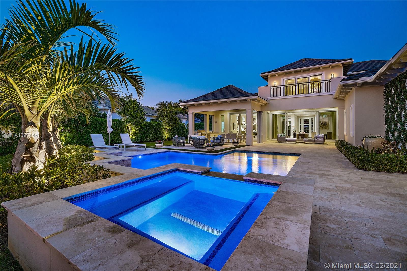 Spectacular Transitional style estate on 1/2 acre lot with stunning golf course and lake views. This spacious 4 bedroom open concept home is full of natural light. Designed to entertain with chef's kitchen and top of the line appliances featuring a wolf gas range, subzero refrigerator, wine refrigerator and separate ice maker. Large den with private office and an additional media room are the perfect place to relax. Custom designed walk in closets, elevator and beautiful finishes compliment this fabulous property. A large covered lanai with summer kitchen and electric screens overlook the pool and spa on one of the best golf course lots.