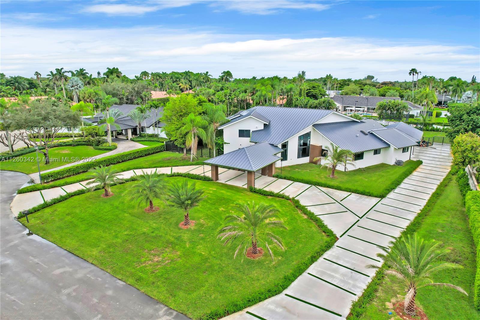 Completely Renovated Custom Luxury Acre Estate in the prestigious Galloway Glen Neighborhood. The Stunning Estate features a triple split floor plan with 6 bedrooms 5 bathrooms, Swimming pool, Tennis Court, Basketball Court, Spa,  3 car garage, new driveway with a porte-cochere. The custom walnut wood features surrounding this home is a spectacular addition to the modern contemporary finishes which include 48x48 European tiles, aluminum rails, LED lighting, A Chef's Kitchen with JenAir Built in Appliances, and a Custom built BBQ grill. Luxurious Master bedroom suite with balconies over looking the pool, private bar, custom walk-in-closets, and an amazing master bathroom with sauna. New Metal Roof with Impact Glass doors and windows. 6,832 SQFT of GLA 40,075 SQFT LOT! Priced @ $585 per ft