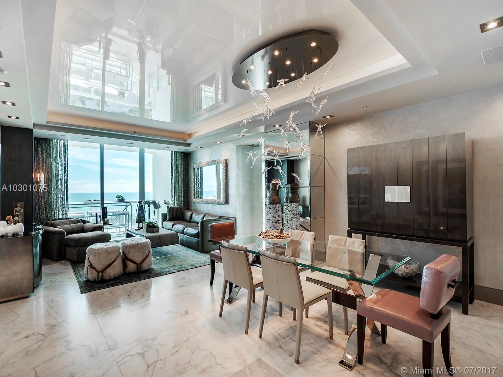 Contemporary oceanfront masterpiece with elegant decor by Christopher Raessler of RGR Design Associates. 1977 sq.ft. of impeccable living space plus spacious balcony with direct ocean view. Private foyer entrance, crystal oyster antique marble floor, Boffi & Donbracht baths, custom cabinetry with TV lift, AV system, custom drapery with motorized solar shades. Continuum offers 12 acres of luxury living with pool & beach service, gym & spa, 3 tennis courts, restaurant, concierge, valet parking & security.