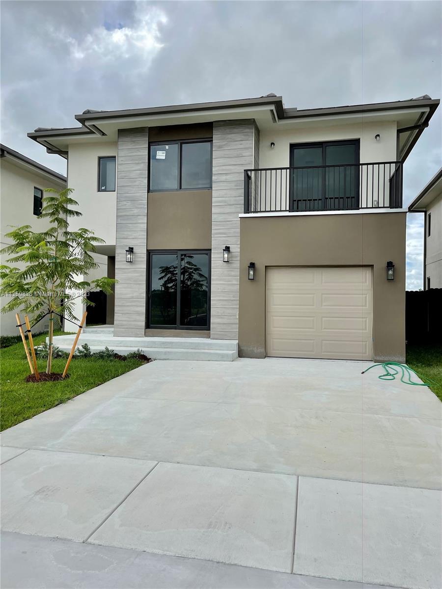 AMAZING NEW CONSTRUCTION, 2 story home, 5 beds 4.5 baths, garage & fenced backyard. Located in a great residential community in Florida City. Beautiful open kitchen with s/s appliance, stone counter top, double sink. Front load full side washer & dryer. Title flooring throughout the house, impact windows. This house offers a full bedroom with closet & bathroom downstairs . Master room with walking closet and double sink in bathroom. Excellent finishes throughout the house. YOU HAVE TO SEE IT!!!!! ONLY 1st MONTH RENTAL AND 1 MONTH SECURITY DEPOSIT!!