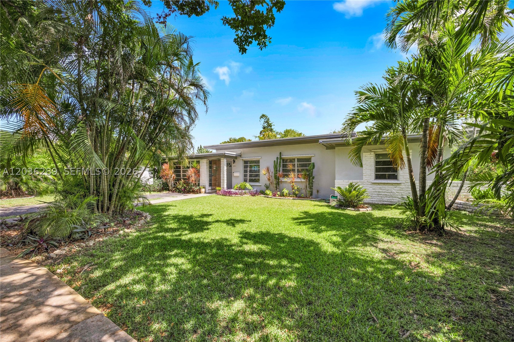 This classic Florida ranch-style home checks all the boxes for comfortable South Florida living. Inside, you'll find three spacious, sunny bedrooms, a completely renovated bathroom, and brand new flooring throughout. The open living and dining area and separate family room gives tenants plenty of room to spread out. Abundant windows bring in great natural light, and all windows come with blinds already installed — no need to buy or hang a thing.
Additional highlights include a newer AC system, washer and dryer inside and ample parking. Out back, a large private backyard offers room to relax or entertain. Walking distance to the University of Miami and minutes from downtown South Miami, Whole Foods, Merrick Park you will be in the center of everything you need. Situated on SW 48 St which has sidewalks on both sides of the street. Adjacent to Coral Gables and Biltmore Heights, a fabulous walking neighborhood.  Available immediately. Tenants to provide background and credit check.