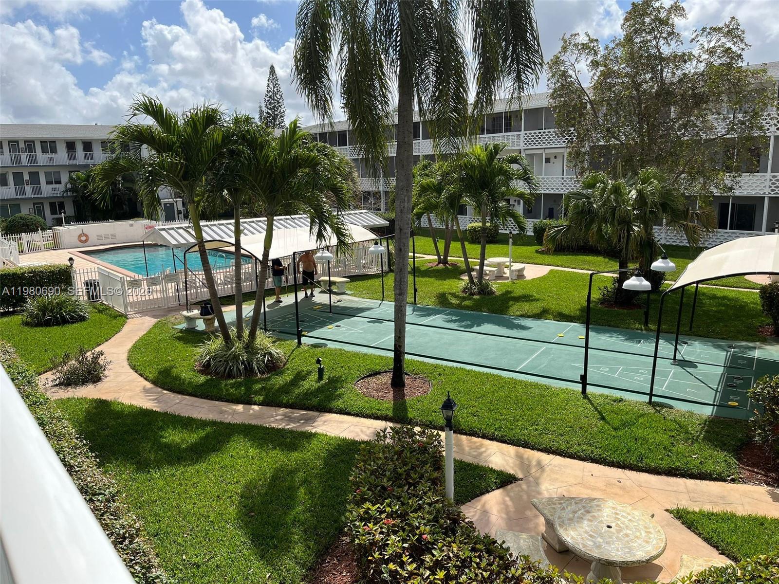 Spacious and bright second floor 1-bedroom, 1-bath co-op located in a quiet and well-maintained 55+ community. This inviting unit offers a comfortable and functional layout with generous living and dining areas, abundant natural light, direct view to the pool area,and screened balcony. Enjoy peaceful living in a friendly active-adult community with beautifully maintained grounds and a relaxing atmosphere. Conveniently located near shopping, county parks (Oak Grove Park,across) dining, medical facilities, and major roadways. A fantastic opportunity to own an affordable home in a desirable South Florida location—perfect for year-round living or a seasonal retreat. Co-op ownership. Cash purchase required. Association approval required. "No Leased land"