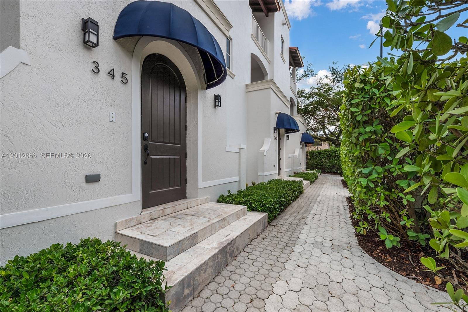 The Madeira is a limited collection of four exceptional townhomes in the heart of Coral Gables’ financial district. Thoughtfully designed across three levels, each residence features a private rooftop, in-home elevator, expansive bedroom suites, and light-filled interiors with soaring ceilings. No. 345 residence is a desirable interior unit, offering added privacy, amazing space, Private two-car garages and a boutique, private setting offer both comfort and exclusivity—just steps from the energy, dining, and business core of the city. An elevated lifestyle in a premier location.