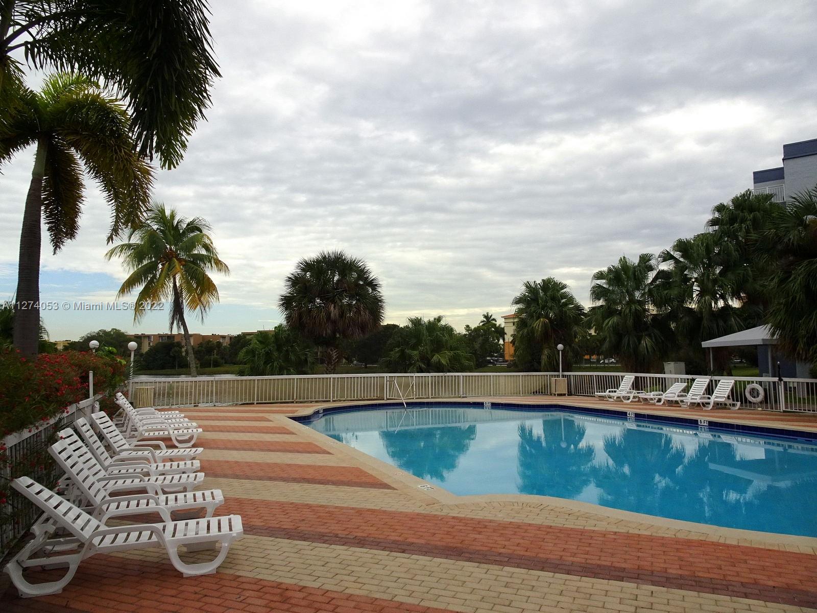 Location, Location!!!  Guard Gated Community near FIU University, FL Turnpike, 836 & 826 HWY., Dolphin Mall and more... Super Spacious layout 1,415 sqft., 2-story condo townhome style, 2/2.5, main suite has private balcony upstairs besides balcony downstairs, laundry area upstairs (need connections),  walk-in closet, 4th floor (last floor/no noise above you), Bldg. has elevator. Association only allows 2 cars per apartment & 2 pets 30 lbs. total for both pets. Plenty of guest parking. Amenities: 3 Swimming Pools, Gym, BBQ areas around lake, Playground, & others w/future renovations (tennis court, racquet ball).  Community still working 40 yr. recertification w/liens & violations until finished. CASH ONLY!! NO RESERVES. Sale AS-IS Condition, unit needs work, Vacant, MLS Showassist appt.