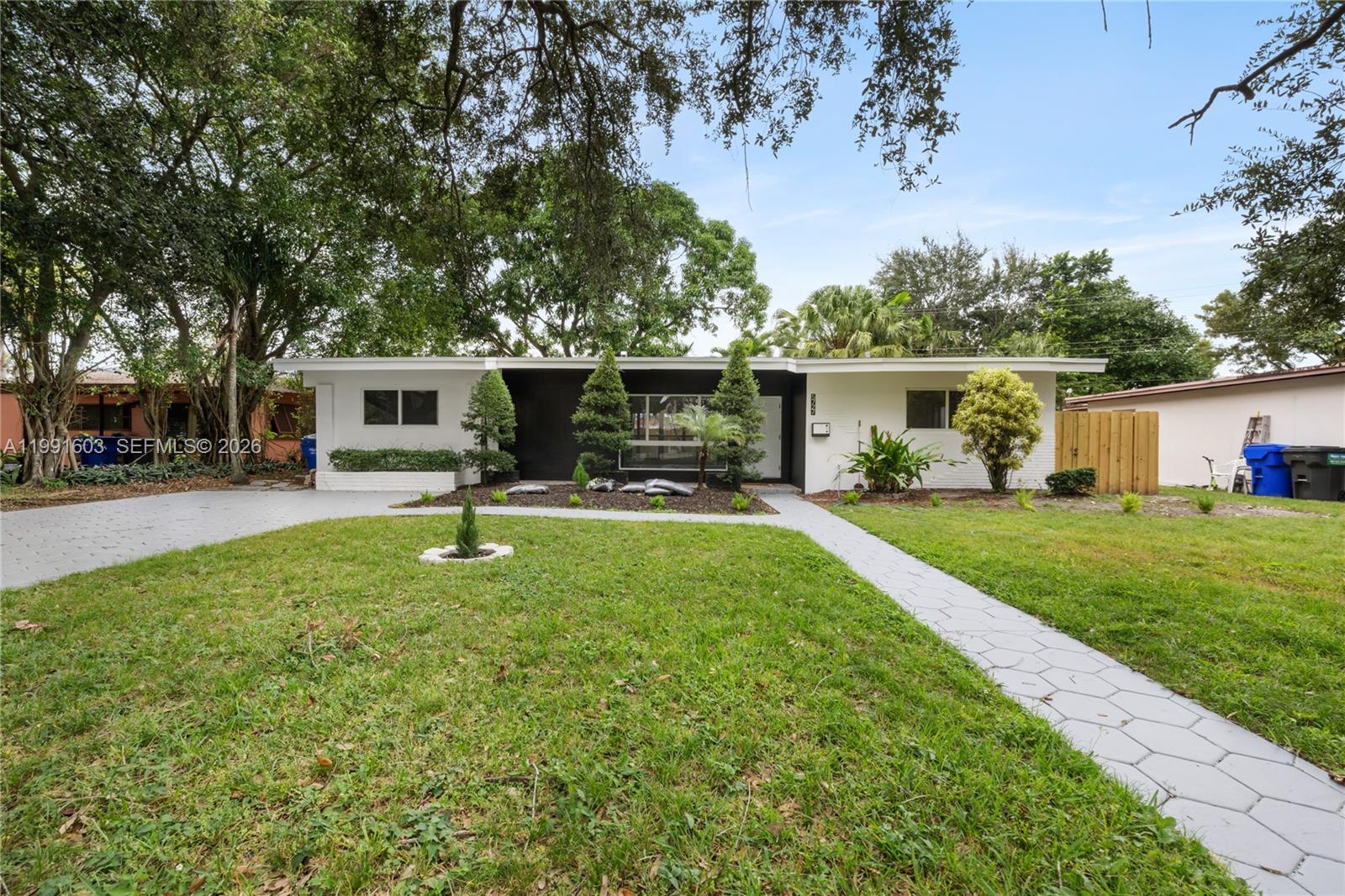 Beautifully renovated 3-bedroom, 2-bath home located in an amazing, highly desirable neighborhood. This property features a bright and spacious open-concept living area with sleek tile flooring, modern recessed lighting, and large impact windows that fill the home with natural light. The updated kitchen offers stainless steel appliances, contemporary cabinetry, and a stylish backsplash—perfect for entertaining. Enjoy a generous backyard space ideal for relaxing or hosting, all just minutes from shopping, dining, and major highways.