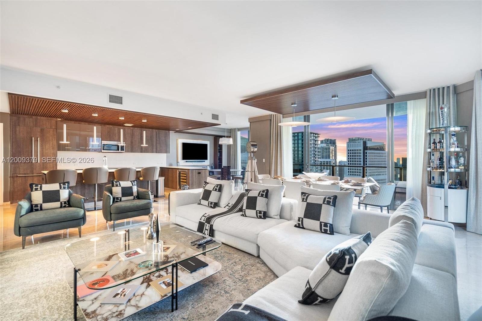 Unmatched value in Brickell! This expansive 4 Bedrooms plus a extra room 4.5 Bathrooms corner home at Rise, Brickell City Centre delivers sweeping water and city panoramas from oversized wraparound terraces. Designed for both style and function, interiors feature marble flooring, custom Italian cabinetry, quartz island kitchen, sleek floating vanities, and automated shades. Each bedroom is complete with generous walk-in closets, plus a large laundry room and private staff quarters with full bath. Two assigned spaces and guest valet parking add convenience. Located above Brickell’s premier destination for luxury shopping and dining, this residence combines world-class amenities with the ultimate Miami lifestyle—offered at the most competitive price for a 4-bedroom in the building.