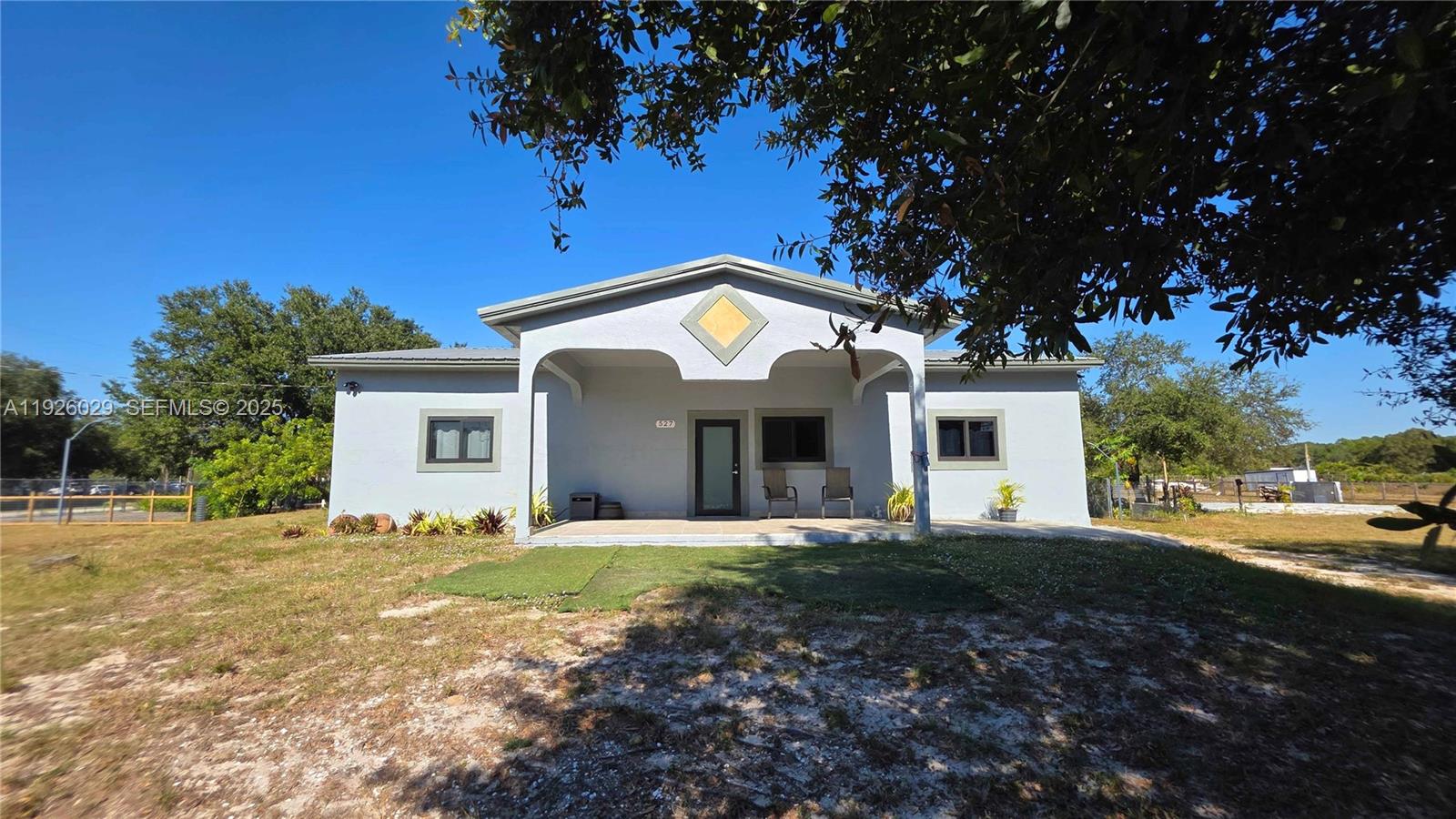 Beautifully remodeled Single Family Home on a peaceful 2.5-acre lot, offering space, privacy, and a true countryside lifestyle. Property features new porcelain tile flooring throughout, fresh interior and exterior paint, and a brand-new A/C unit for added comfort. High-impact windows and doors provide safety, energy efficiency, and hurricane protection.

The property is fully fenced with two large gated entrances, ideal for easy access and added security. A brand-new 30’ x 20’ structure offers great versatility—perfect for storage, workspace, or hobbies. The home is equipped with a well and septic tank, helping to lower utility costs.

Furniture is negotiable for seamless occupancy. A perfect retreat for families looking for tranquility and room to grow. Enjoy the natural surroundings while still having the potential to personalize outdoor spaces.

Mobile home on site does not convey. Property is being sold AS-IS.