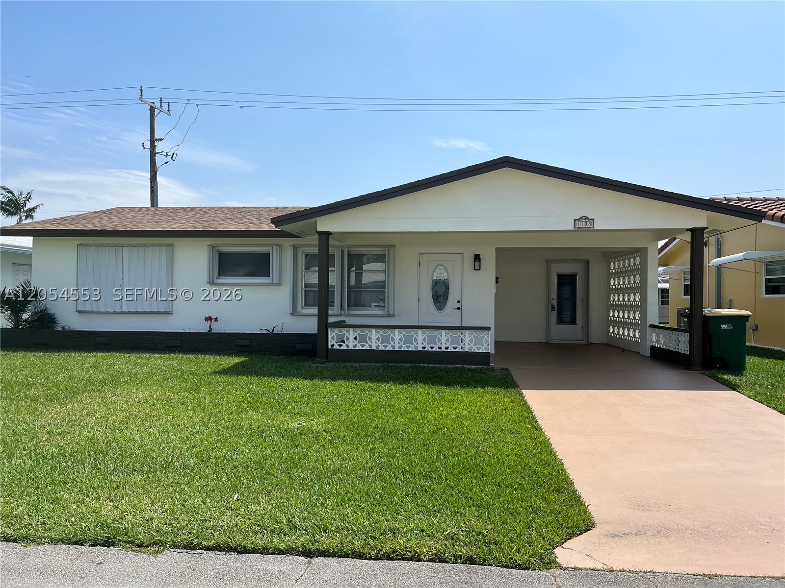 Welcome to this beautifully maintained 2-bedroom, 2-bath single-family home in the highly desirable Mainlands of Tamarac Lakes, a vibrant 55+ community. Freshly painted inside and out, this home features a bright, open floor plan with spacious living and dining areas, an eat-in kitchen, a large primary suite with a walk-in closet and private bath. New roof installed in 2022—covered carport with extended driveway. Low HOA includes lawn maintenance, clubhouse, and community pools. Conveniently located near shopping, restaurants, and major highways. Buyer must have a minimum credit score of 730 (no exceptions). At least one resident must be 55 years of age or older. No permanent resident under the age of 18 is permitted at any time. Easy to show!