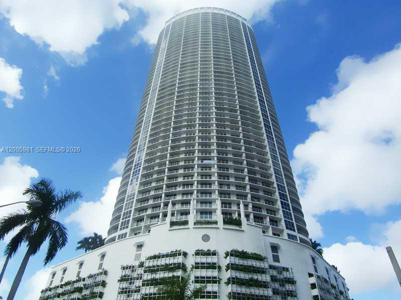 This stunning 29th-floor residence at Opera Tower offers a seamless blend of lifestyle and performance. The 1-bedroom, 1-bathroom layout features a signature wraparound balcony with panoramic views of Biscayne Bay and the Miami skyline. Inside, the home is finished with easy-to-maintain tile in the living areas and comfortable carpet in the bedroom. The kitchen comes fully equipped with stainless steel appliances, including a microwave and dishwasher, set against sleek dark countertops. Positioned in a premier bay-front location directly across from Margaret Pace Park, residents enjoy immediate access to outdoor recreation and an active lifestyle. Luxury building amenities include a fitness center, pool, sauna, and 24-hour security patrol. This unit includes one assigned parking space and benefits from a highly flexible 30-day rental policy. The property is currently tenant occupied, providing immediate cash flow for a buyer who honors the existing lease.
