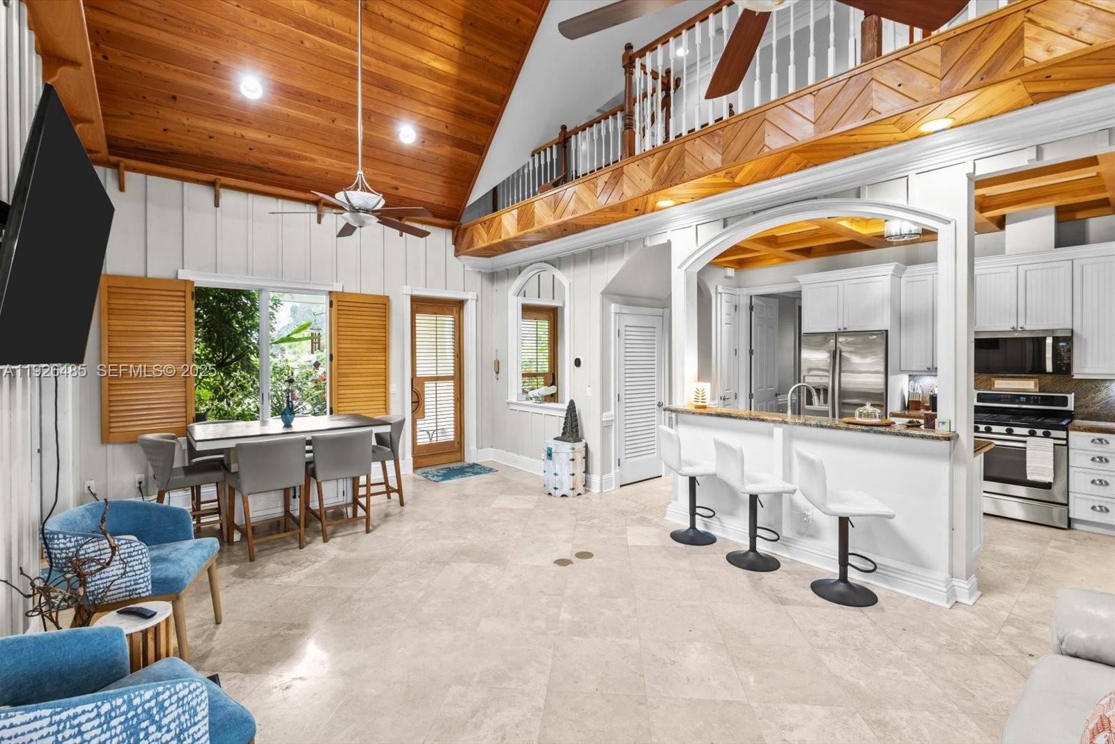 Discover this stunning 6-bedroom, 4-bath luxury villa in the highly sought-after “Old Hobe Sound” community. Designed for lasting comfort and security, this home boasts full impact windows and doors, a higher elevation, and thoughtful craftsmanship throughout. Step inside to elegant travertine flooring, soaring vaulted ceilings adorned with pecky cypress and wood coffering, and classic plantation shutters that add timeless charm.
The spacious gourmet kitchen is a true showpiece, featuring custom wood cabinetry, granite countertops, stainless steel appliances, a gas range, and a generous island—ideal for gathering and entertaining. A dedicated propane tank powers the range, tankless water heater, and a robust 20KW generator for peace of mind.
Outside, retreat to your private oasis complete with a custom pool and expansive paver patio perfect for lounging or hosting. The finished basement offers incredible versatility with two additional bedrooms, a full bar, and a theater room, and laundry.
With no HOA restrictions, you’re free to bring your boat, RV, and all your toys. Optional deeded access to a private Intracoastal boat ramp is available for a minimal fee. Currently operating as a successful Airbnb with impressive income projections, this property is equally suited as a primary residence, vacation home, or investment.

All of this just minutes from pristine beaches, parks, dining, and shopping—coastal living at its finest!