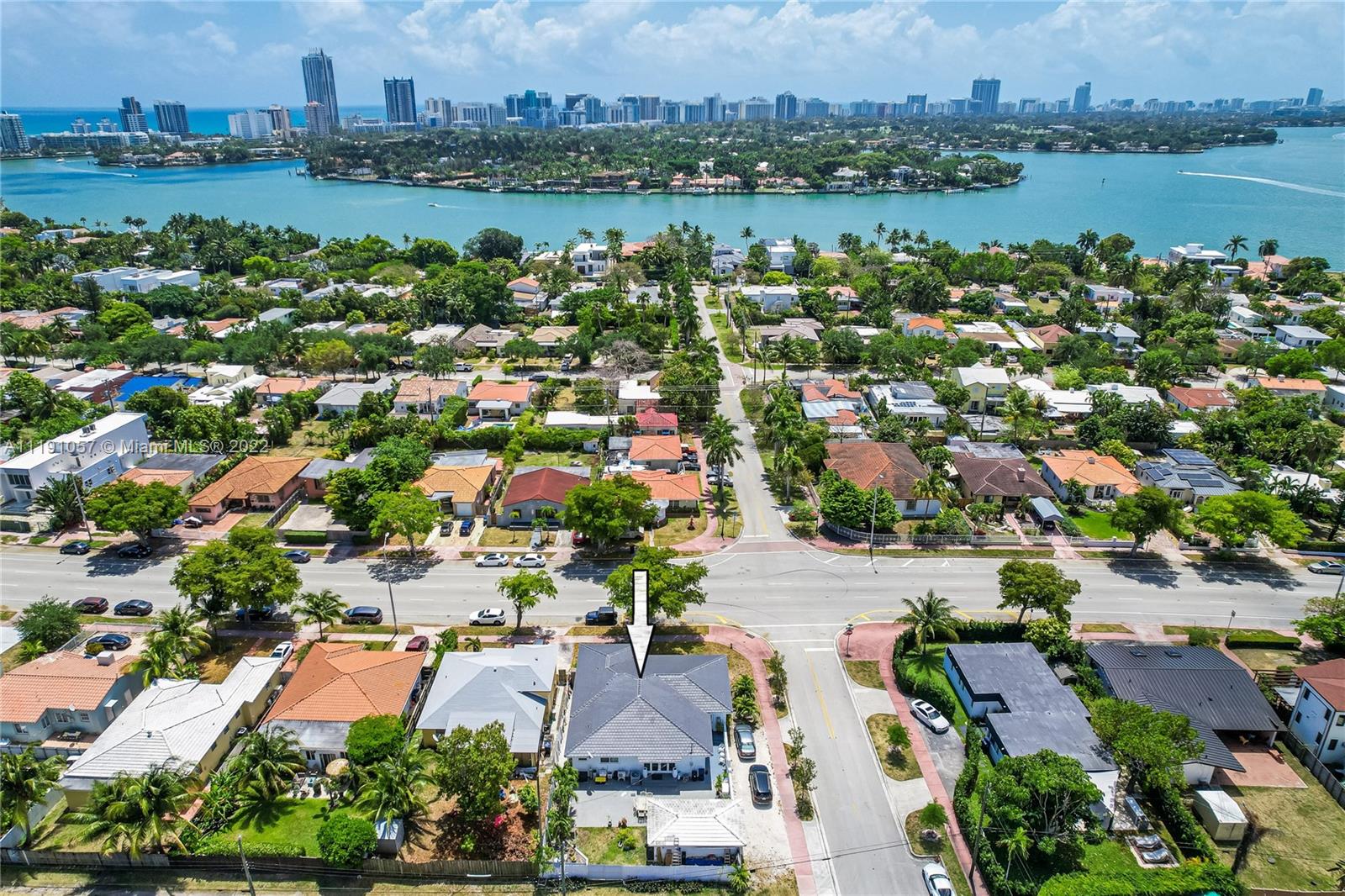 SPECTACULAR, OPEN-CONCEPT, MIAMI BEACH, SFH! Located in the prestigious Normandy Isles, this home features three bedrooms, three full bathrooms, a brand new roof, new hurricane impact windows and rear large French doors, new A/C, large tile flooring in the main living area, laminate and wood flooring in bedrooms, spacious updated kitchen with peninsula seating, beautiful window treatments with great natural light, updated bathrooms and flooring.  The laundry room is inside the home with a sink, counter storage, and an extra refrigerator.  A bonus detached garage can be easily converted into in-law quarters—a gas generator. Located on a corner lot with side parking entry and only steps away from restaurants, farmers market, shopping, golf course, A+ schools, and beach is only minutes away.